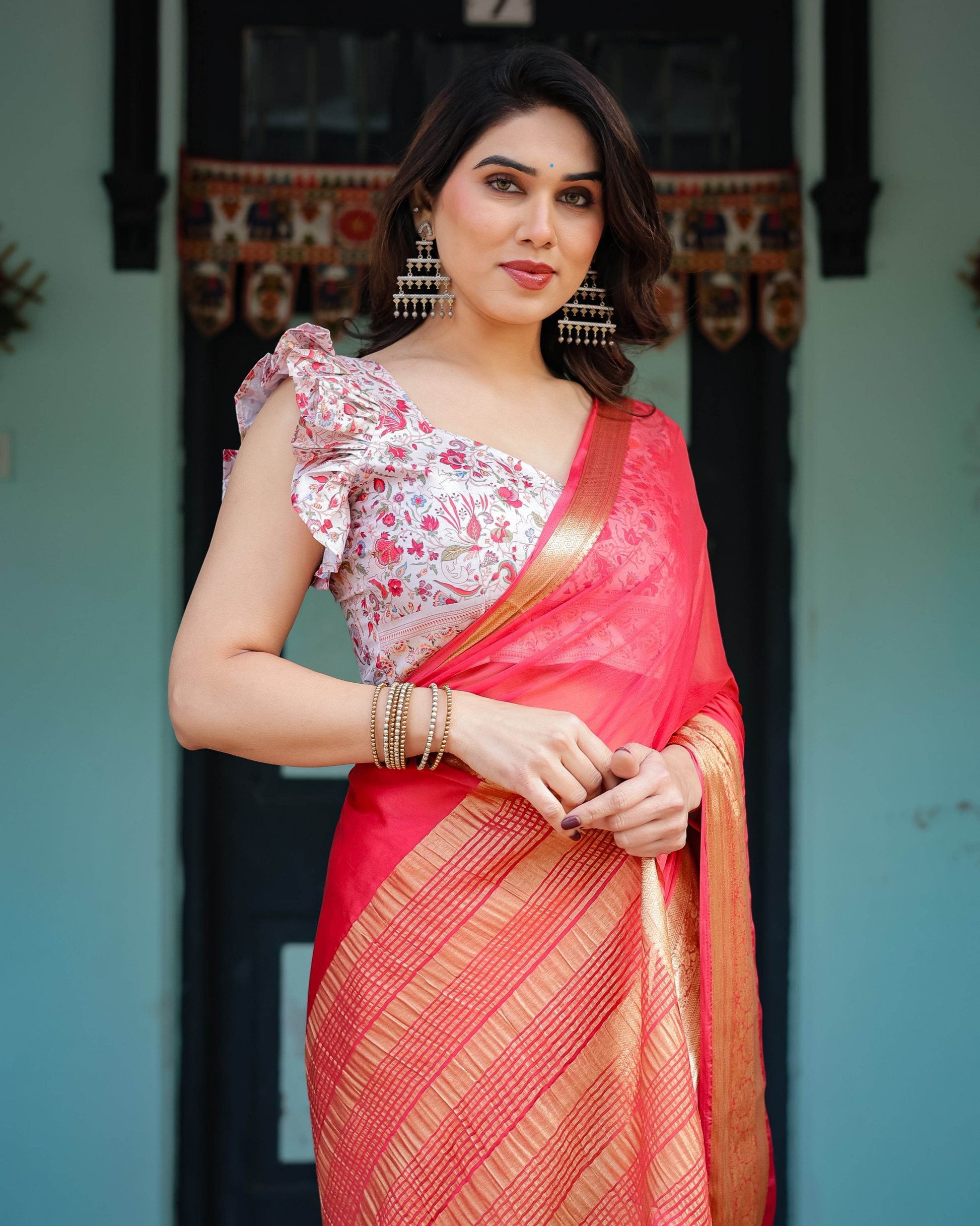 Vibrant Coral Pink Plain Chiffon Saree with Gold Zari Border, Floral Ruffled Blouse & Tassel Detailing - SEEANS