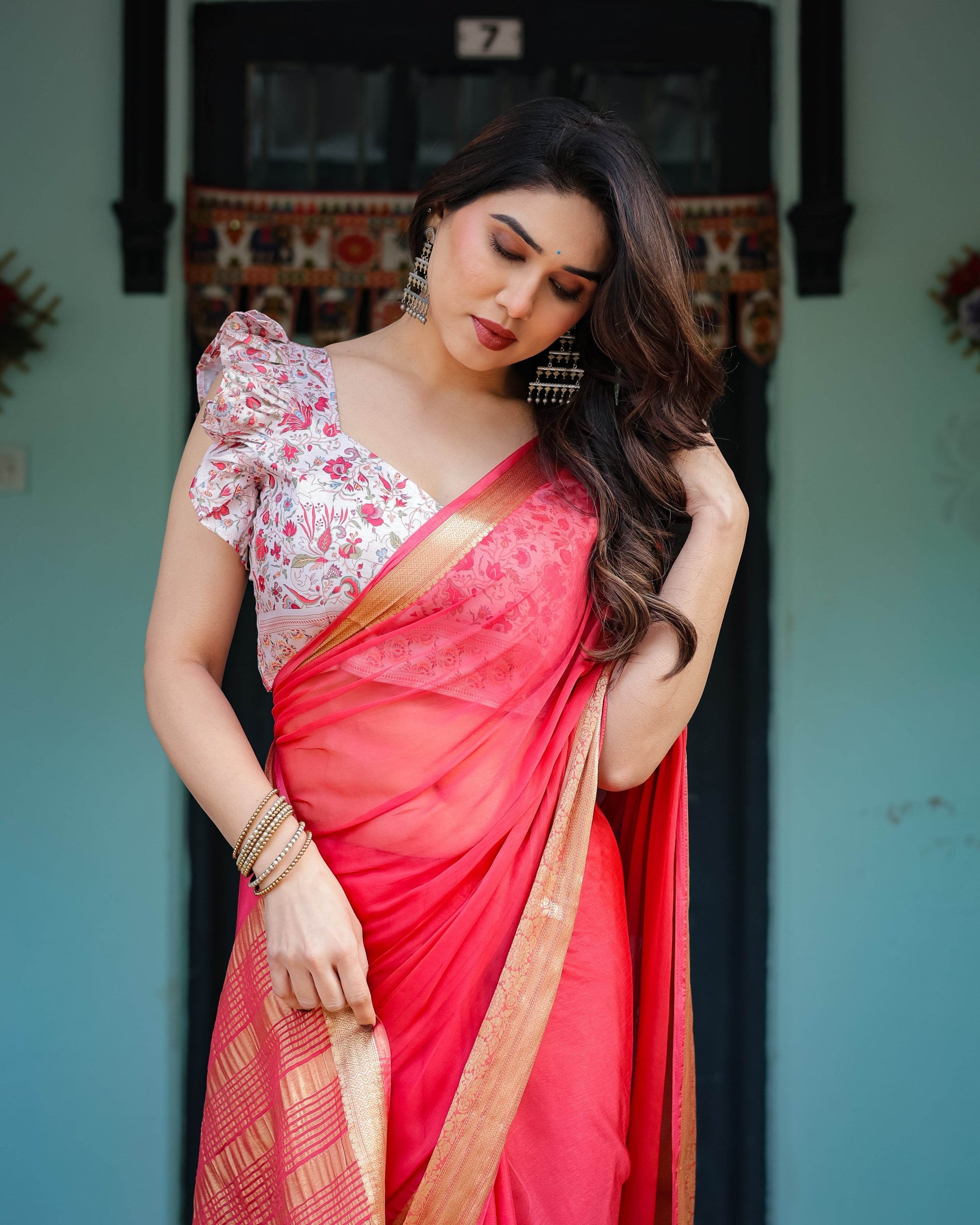 Vibrant Coral Pink Plain Chiffon Saree with Gold Zari Border, Floral Ruffled Blouse & Tassel Detailing - SEEANS