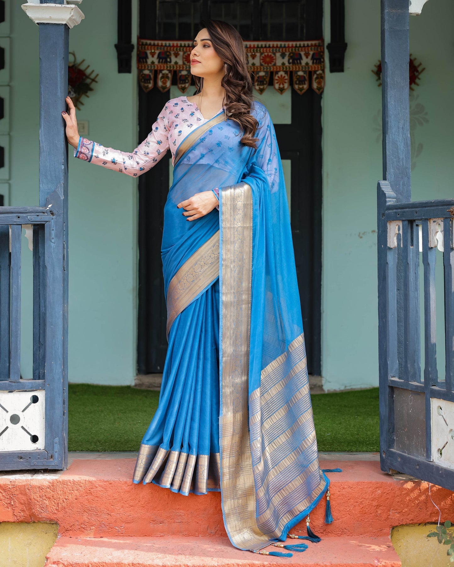 Vibrant Sky Blue Plain Chiffon Saree with Gold Zari Border, Floral Printed Blouse & Tassel Accents - SEEANS