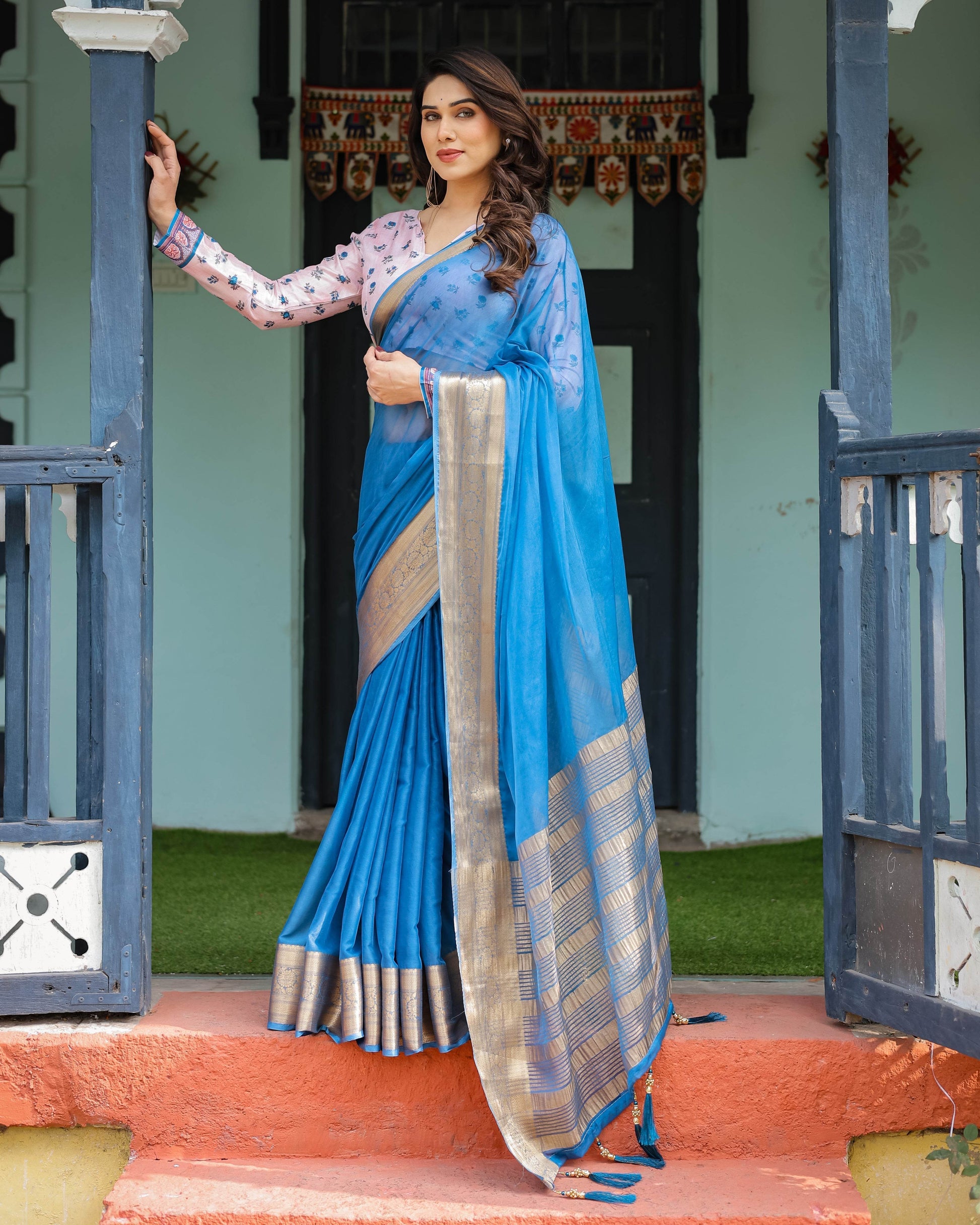 Vibrant Sky Blue Plain Chiffon Saree with Gold Zari Border, Floral Printed Blouse & Tassel Accents - SEEANS