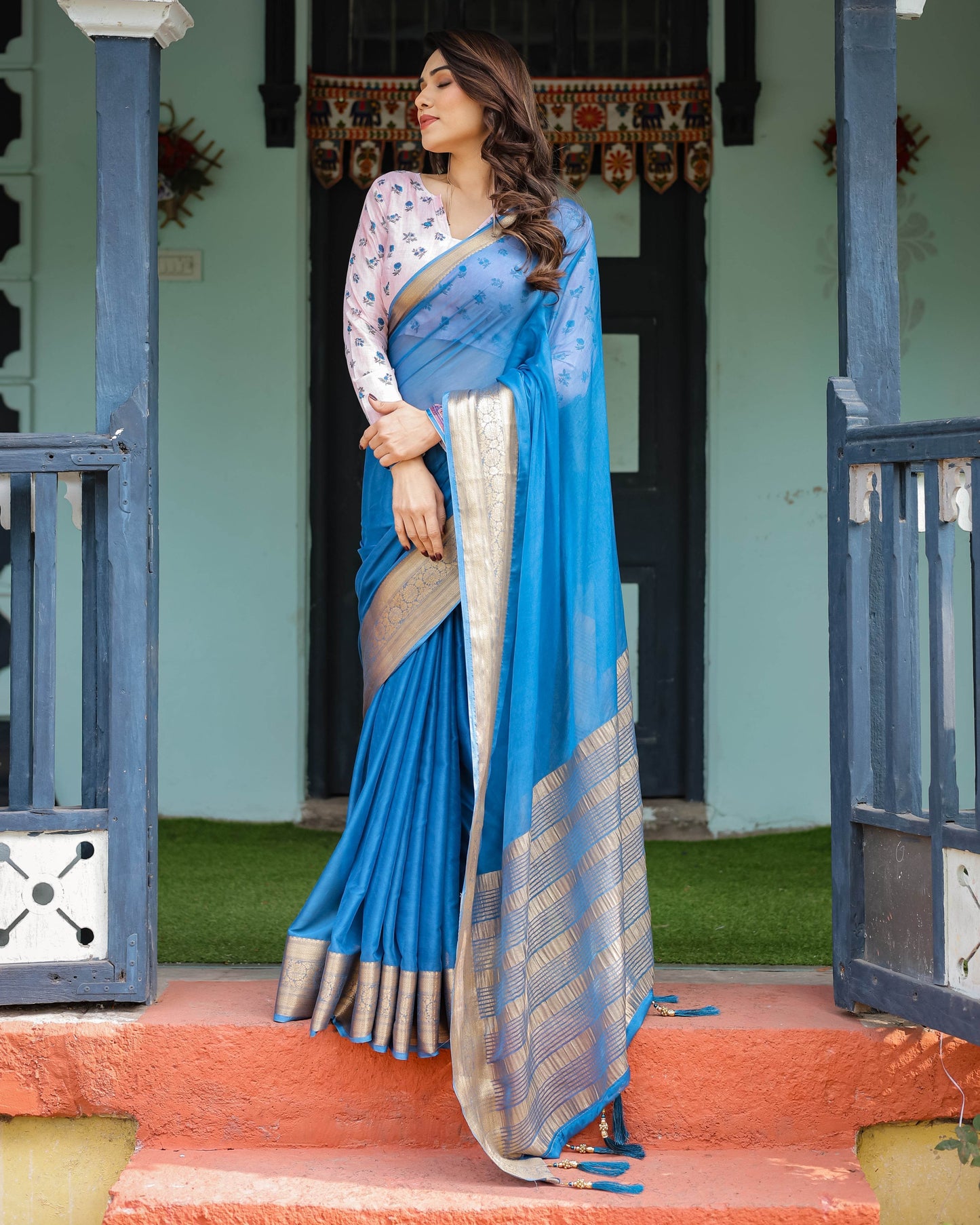 Vibrant Sky Blue Plain Chiffon Saree with Gold Zari Border, Floral Printed Blouse & Tassel Accents - SEEANS