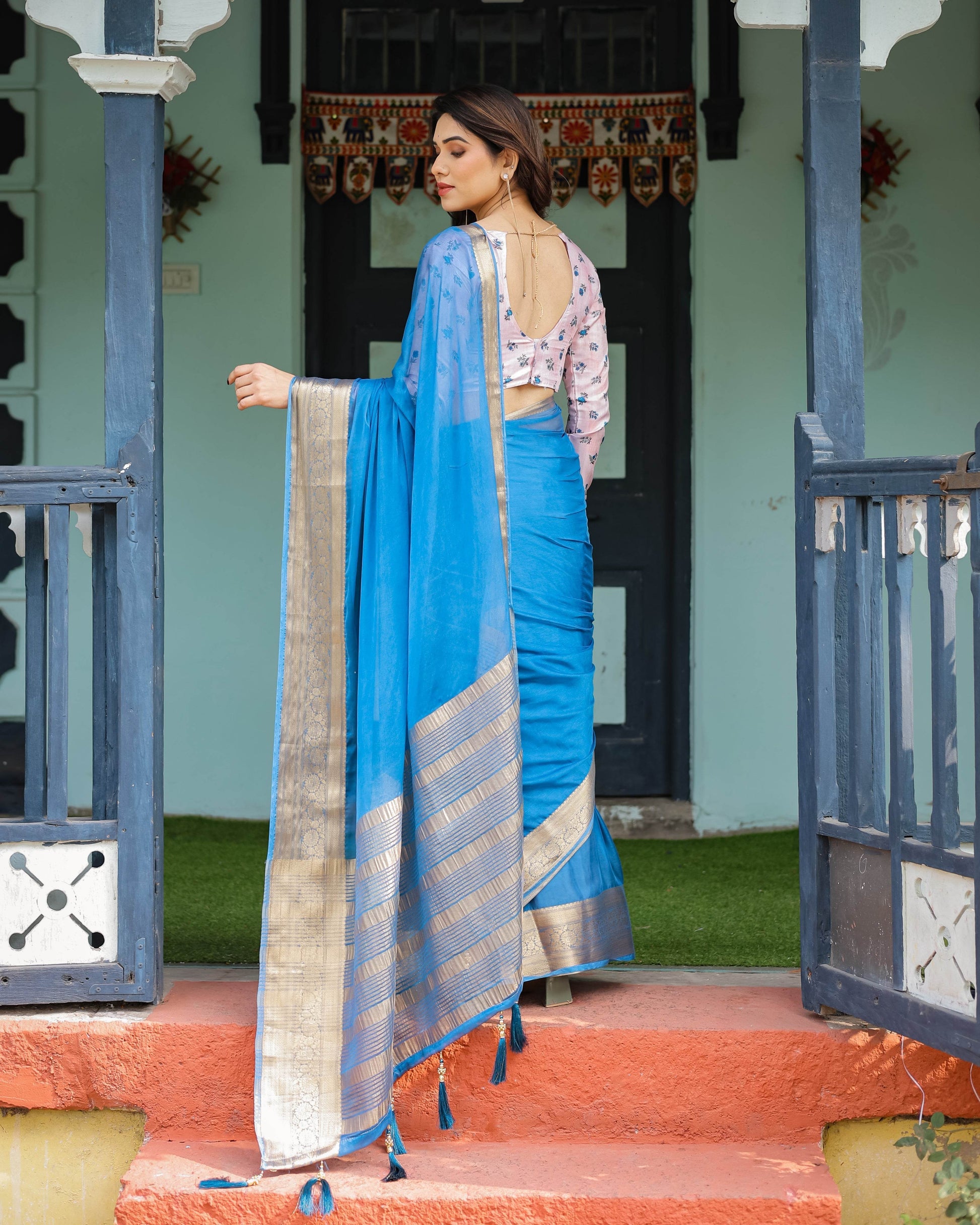 Vibrant Sky Blue Plain Chiffon Saree with Gold Zari Border, Floral Printed Blouse & Tassel Accents - SEEANS