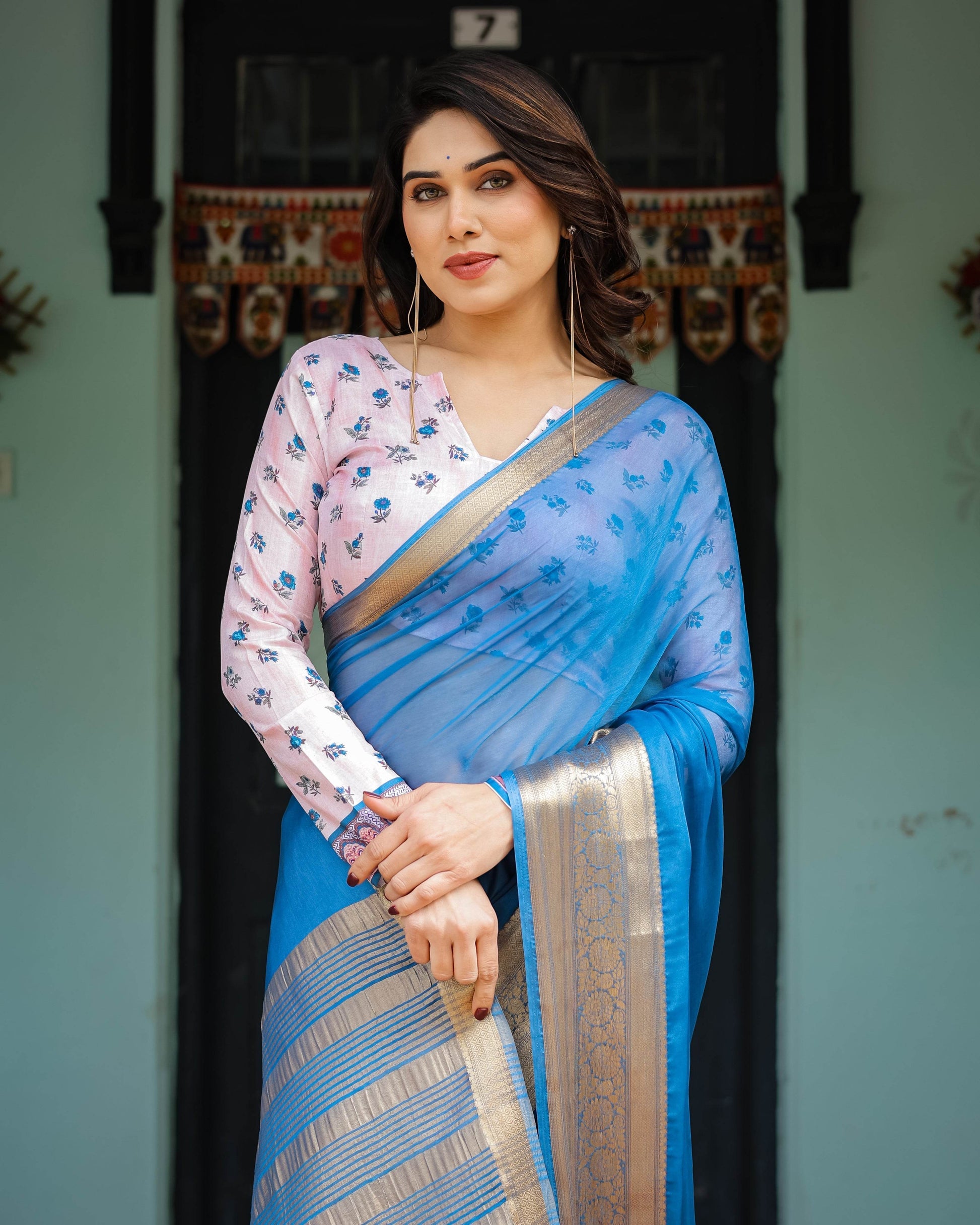 Vibrant Sky Blue Plain Chiffon Saree with Gold Zari Border, Floral Printed Blouse & Tassel Accents - SEEANS