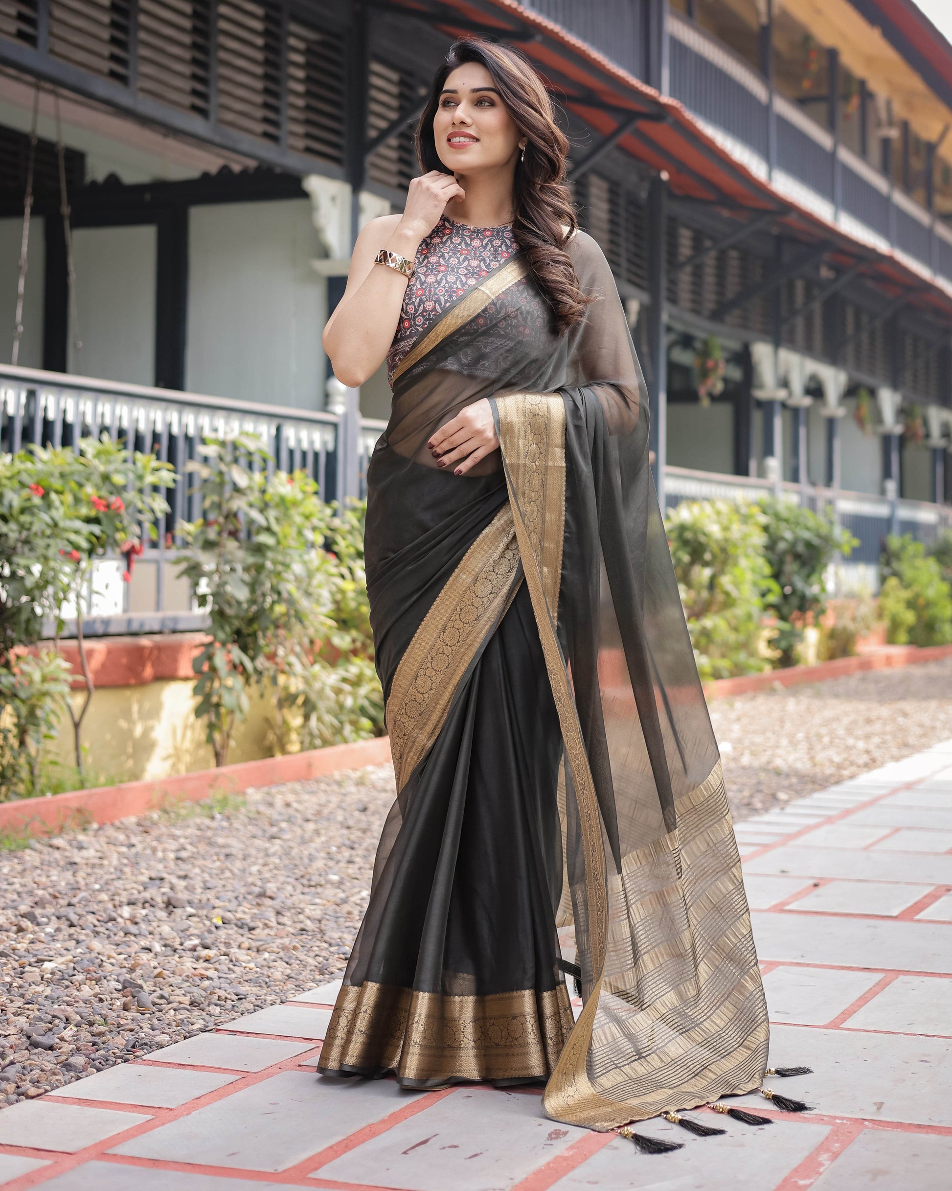 Ethereal Black Plain Chiffon Saree with Gold Zari Border, Floral Printed Blouse & Tassel Detailing - SEEANS