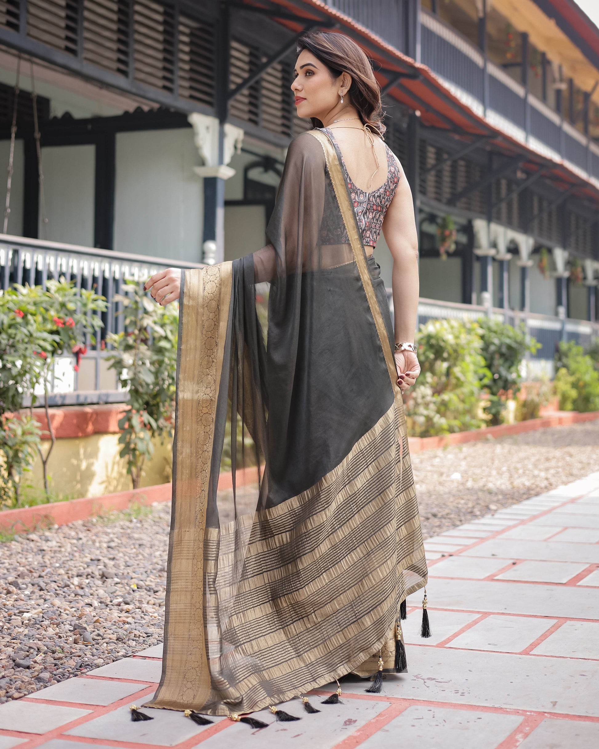 Ethereal Black Plain Chiffon Saree with Gold Zari Border, Floral Printed Blouse & Tassel Detailing - SEEANS