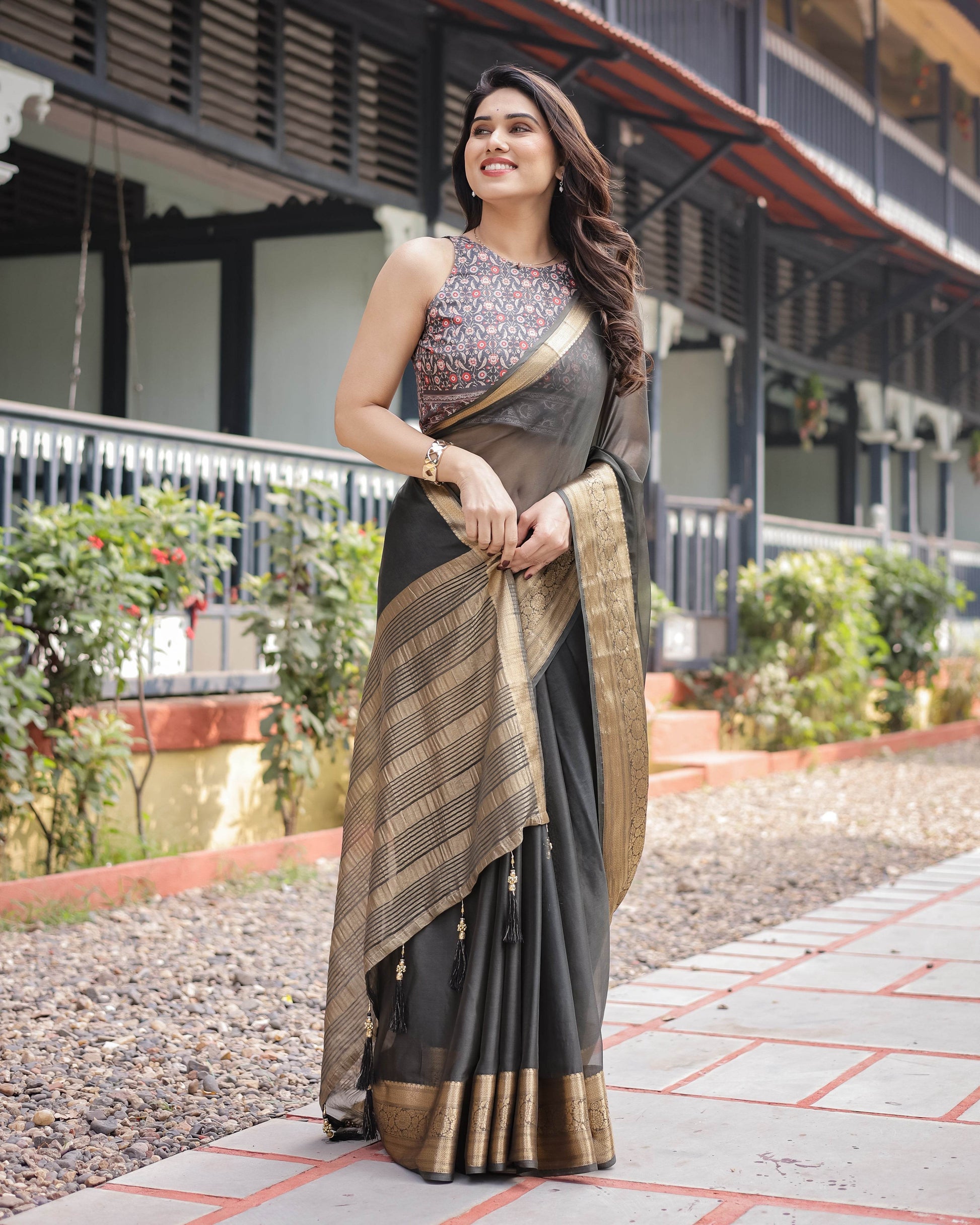 Ethereal Black Plain Chiffon Saree with Gold Zari Border, Floral Printed Blouse & Tassel Detailing - SEEANS