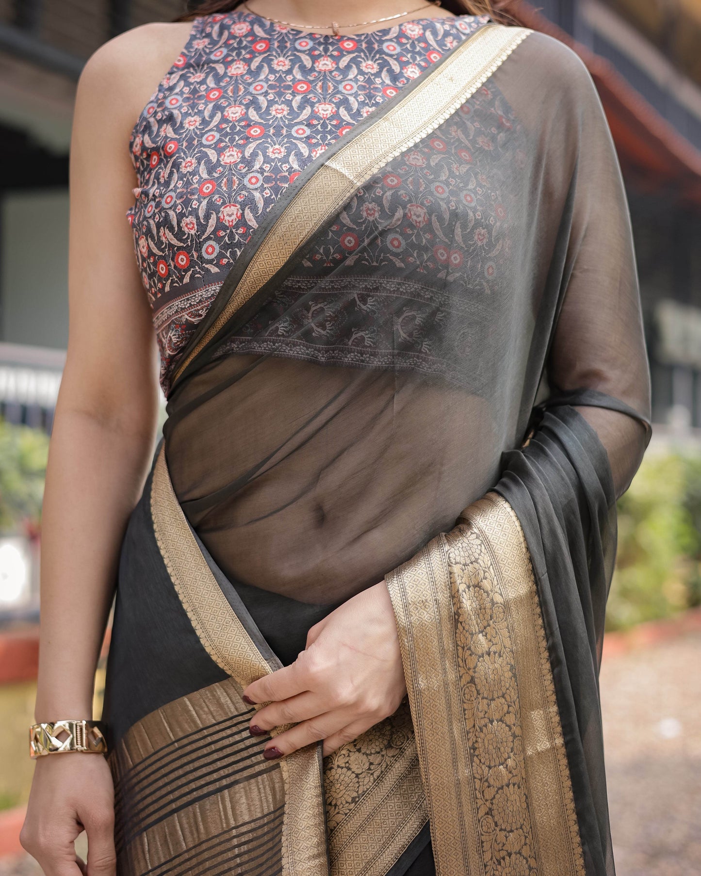 Ethereal Black Plain Chiffon Saree with Gold Zari Border, Floral Printed Blouse & Tassel Detailing - SEEANS