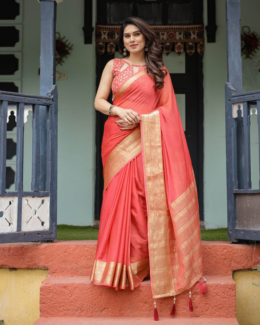 Graceful Coral Pink Plain Chiffon Saree with Gold Zari Border, Floral Embroidered Blouse & Tassel Detailing - SEEANS