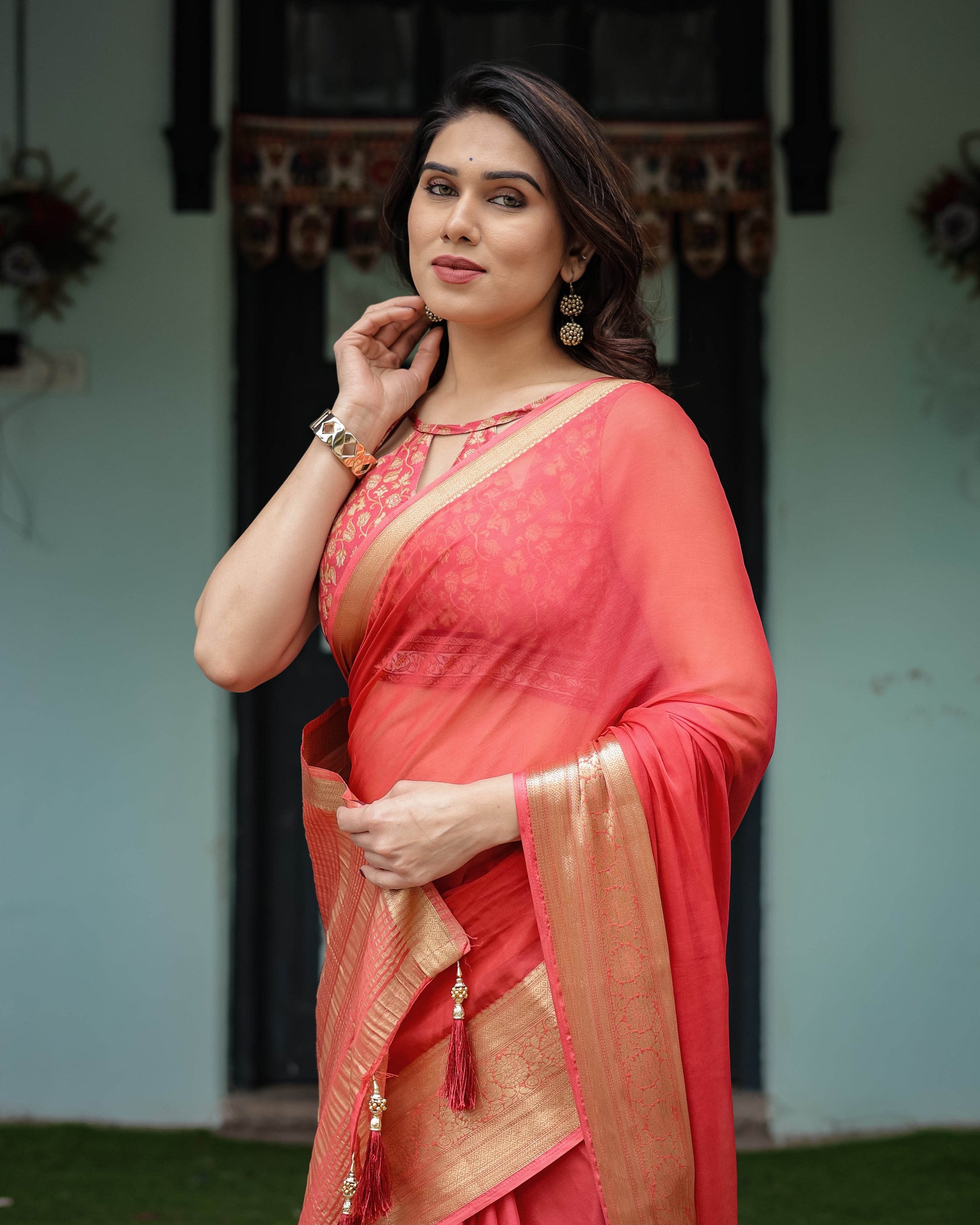 Graceful Coral Pink Plain Chiffon Saree with Gold Zari Border, Floral Embroidered Blouse & Tassel Detailing - SEEANS