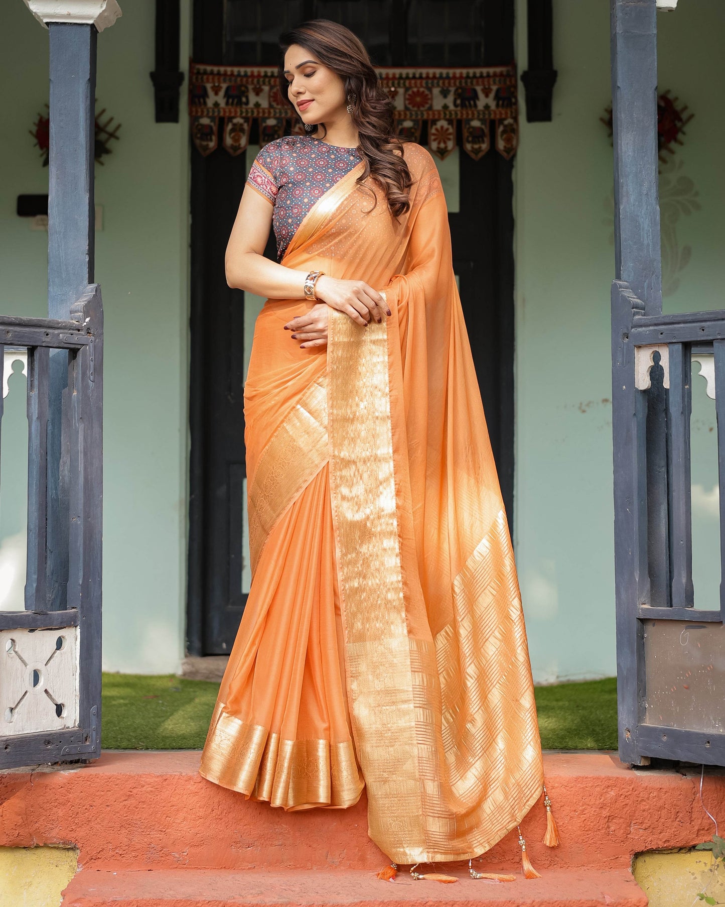 Elegant Tangerine Orange Plain Chiffon Saree with Gold Zari Border, Geometric Printed Blouse & Tassel Detailing - SEEANS