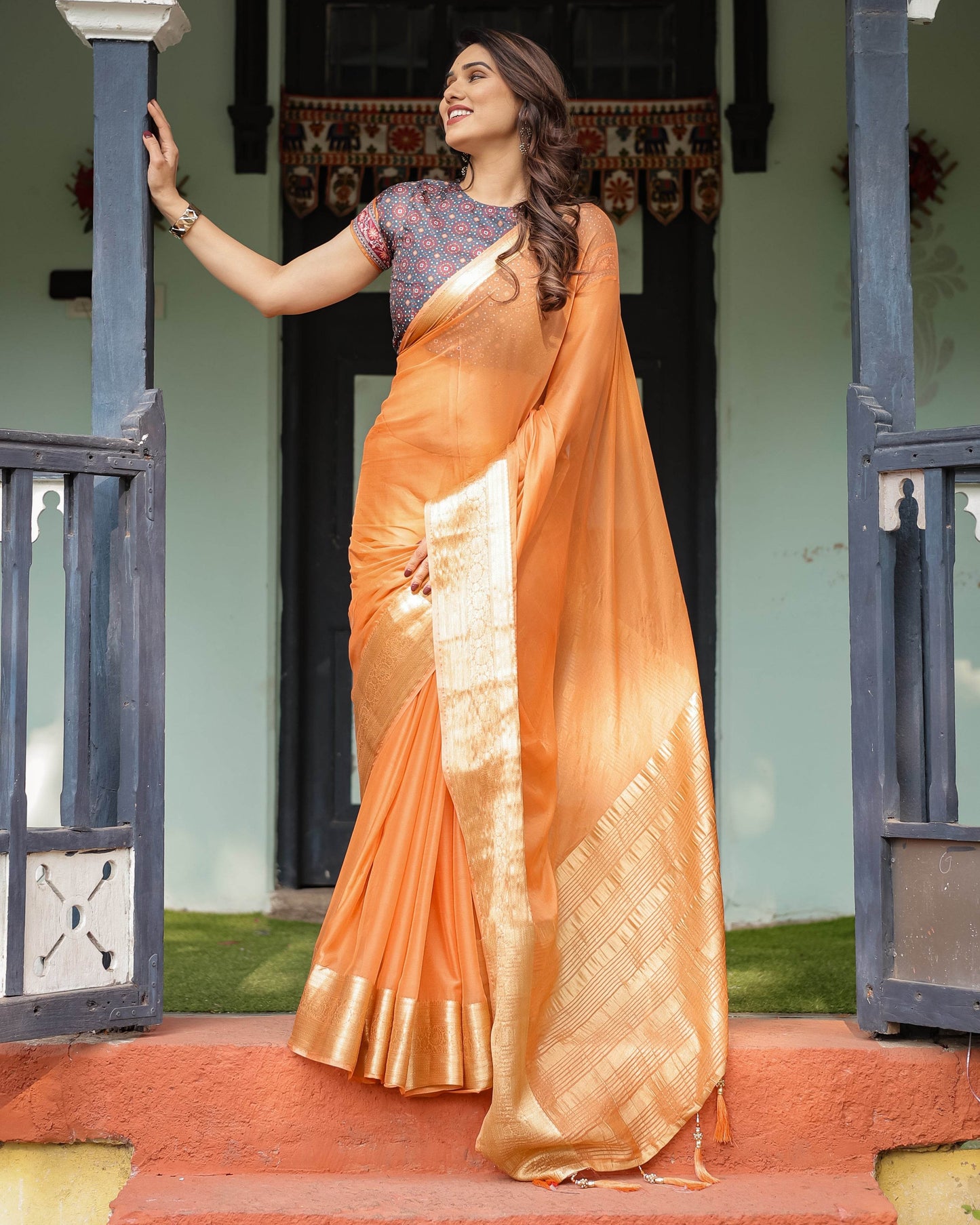 Elegant Tangerine Orange Plain Chiffon Saree with Gold Zari Border, Geometric Printed Blouse & Tassel Detailing - SEEANS