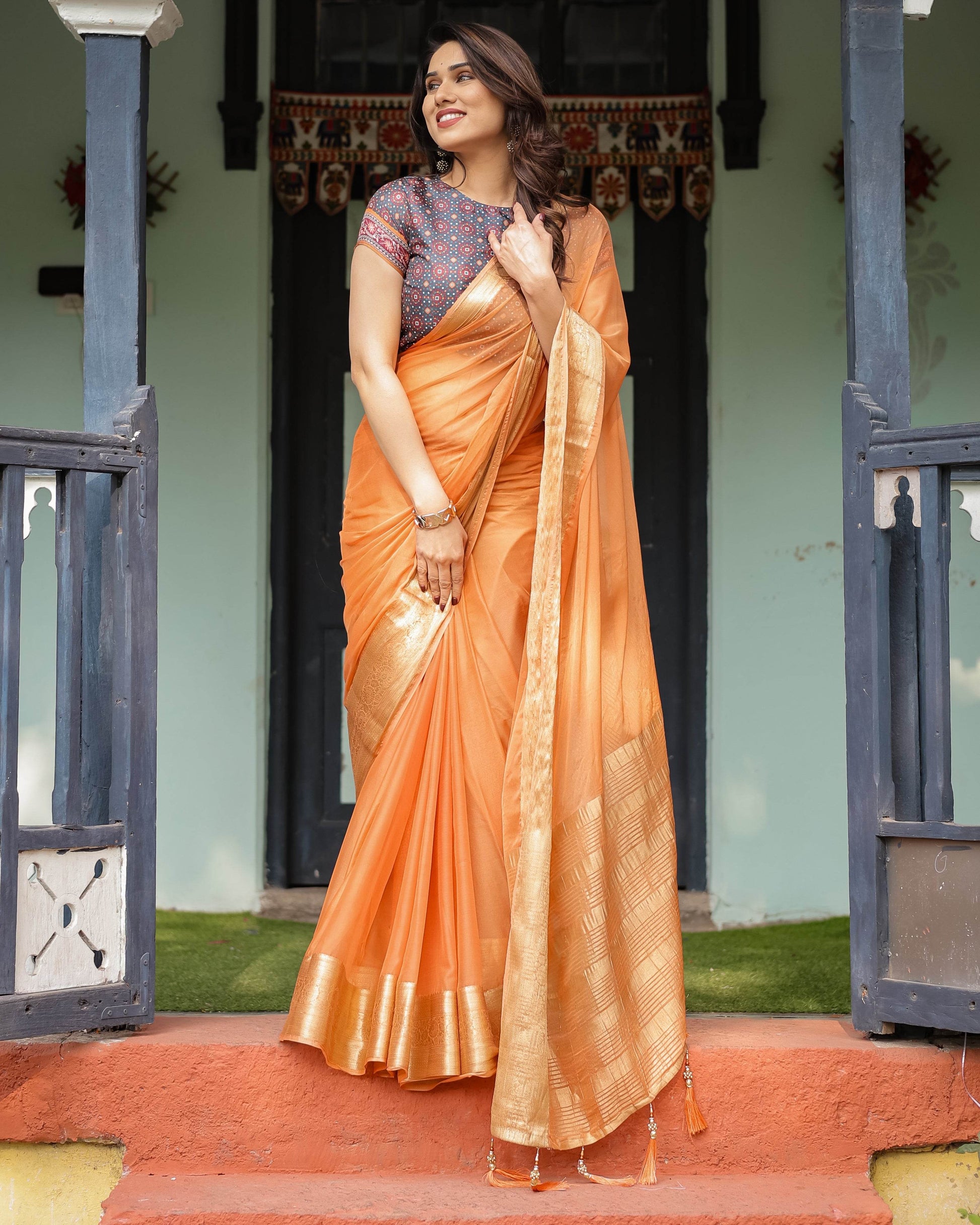 Elegant Tangerine Orange Plain Chiffon Saree with Gold Zari Border, Geometric Printed Blouse & Tassel Detailing - SEEANS