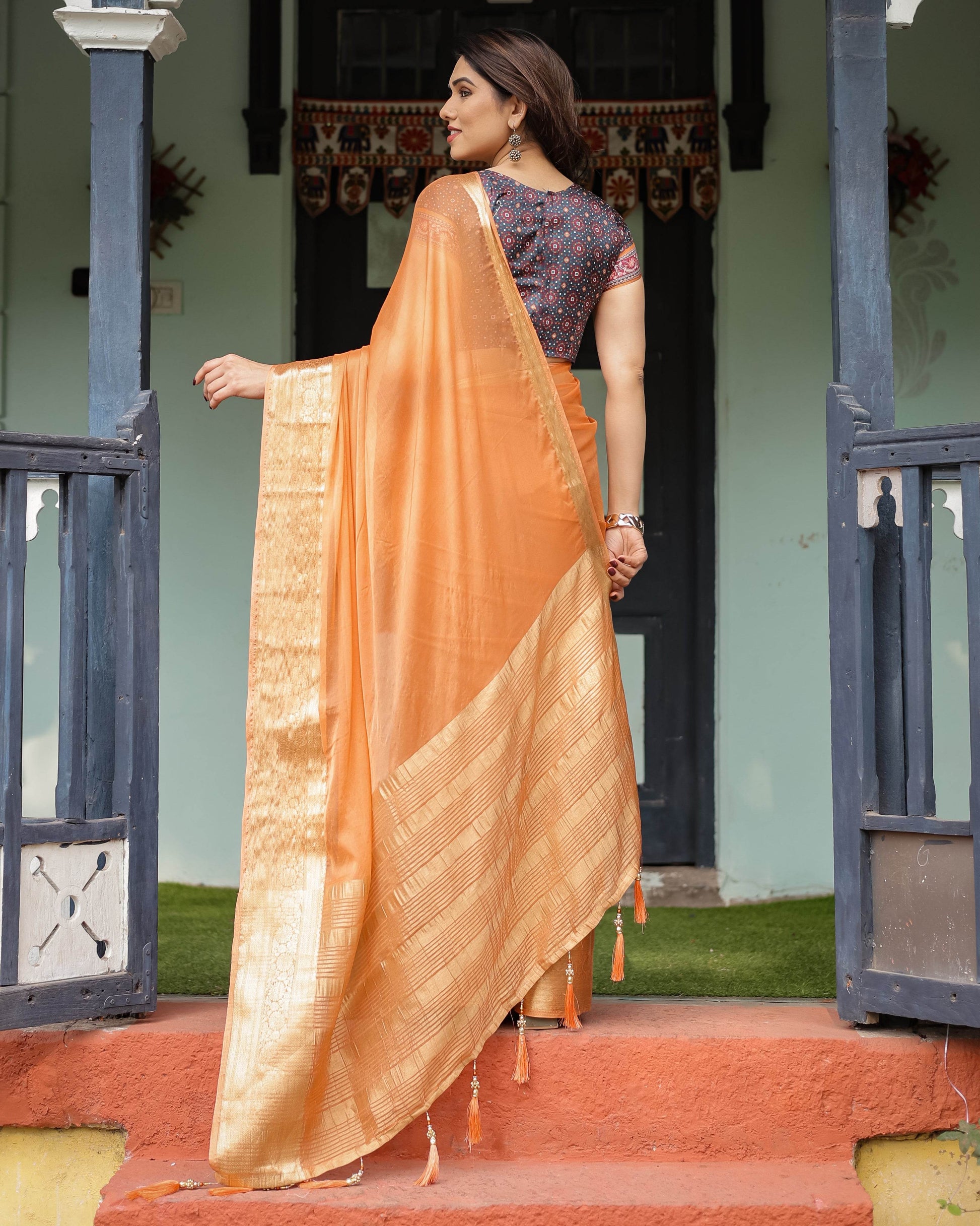 Elegant Tangerine Orange Plain Chiffon Saree with Gold Zari Border, Geometric Printed Blouse & Tassel Detailing - SEEANS