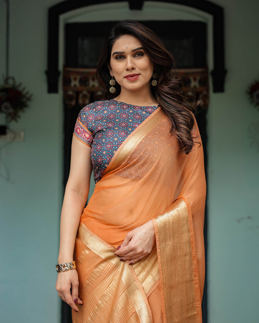 Elegant Tangerine Orange Plain Chiffon Saree with Gold Zari Border, Geometric Printed Blouse & Tassel Detailing - SEEANS