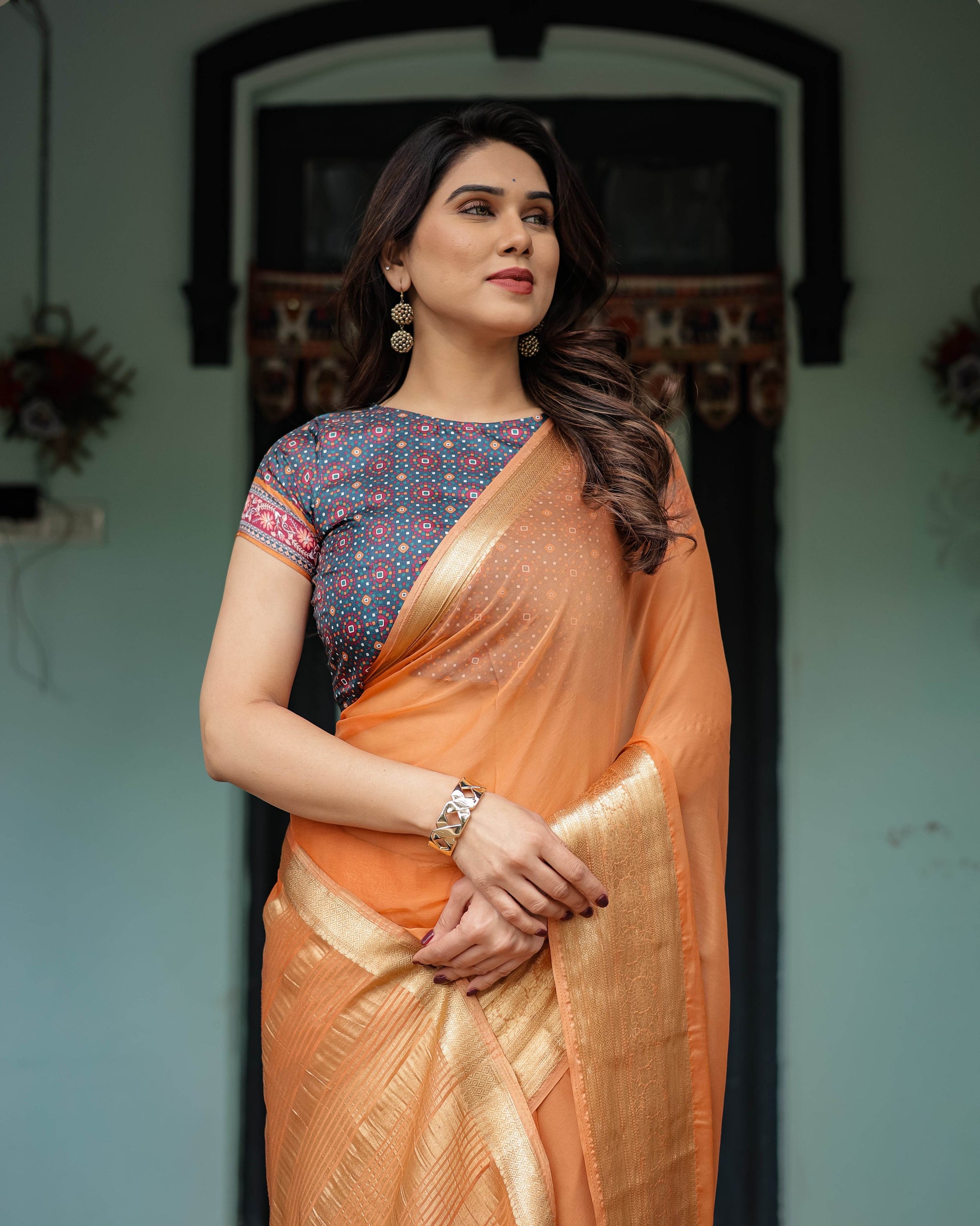 Elegant Tangerine Orange Plain Chiffon Saree with Gold Zari Border, Geometric Printed Blouse & Tassel Detailing - SEEANS