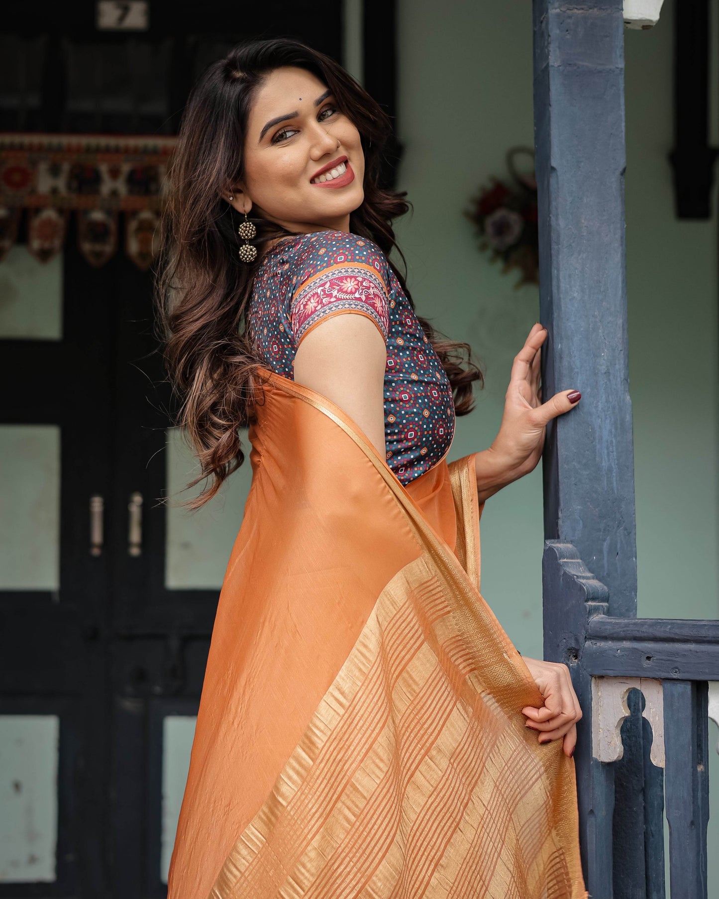 Elegant Tangerine Orange Plain Chiffon Saree with Gold Zari Border, Geometric Printed Blouse & Tassel Detailing - SEEANS