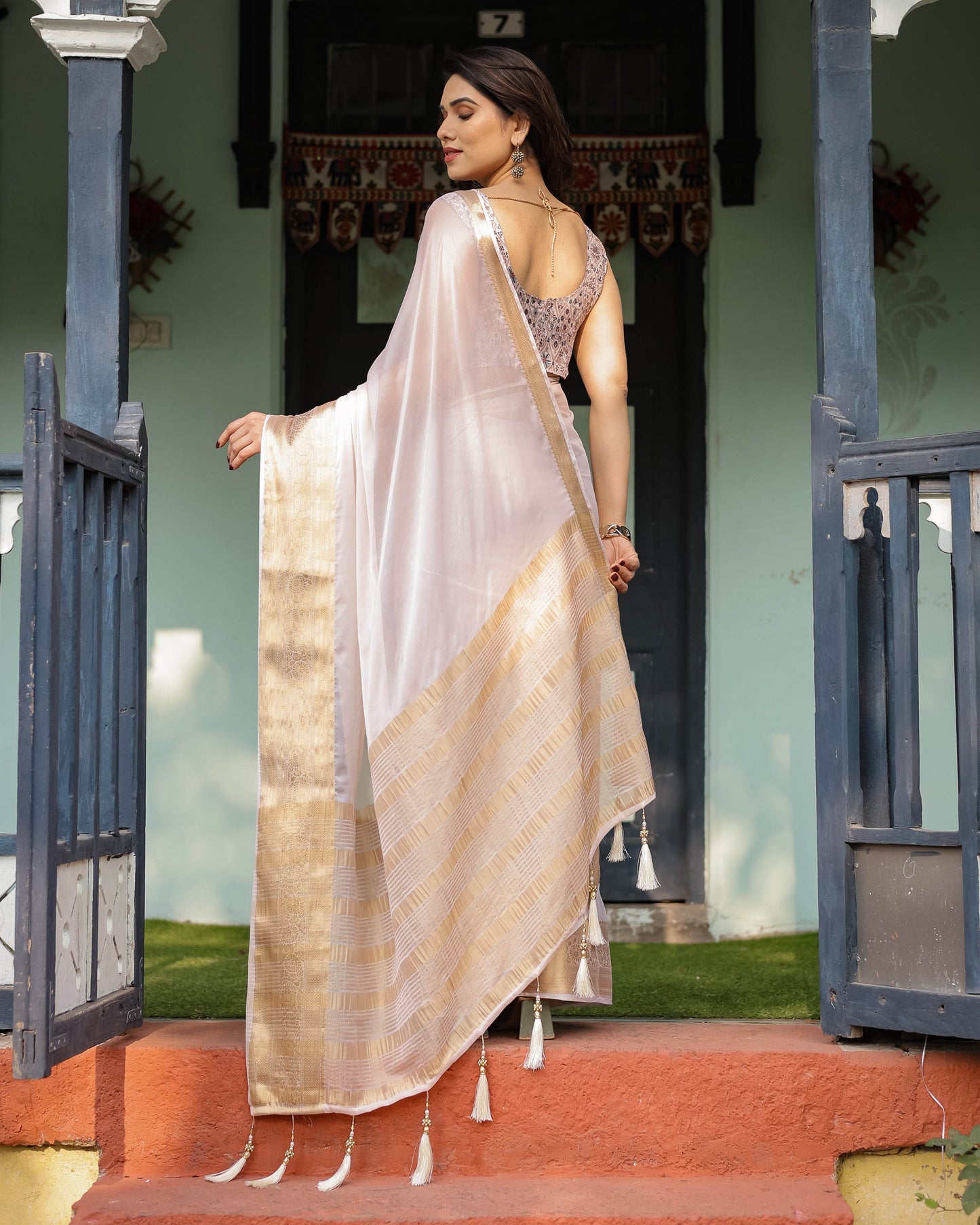 Ethereal Off-White Plain Chiffon Saree with Gold Zari Border, Intricate Floral Printed Blouse & Tassel Detailing - SEEANS