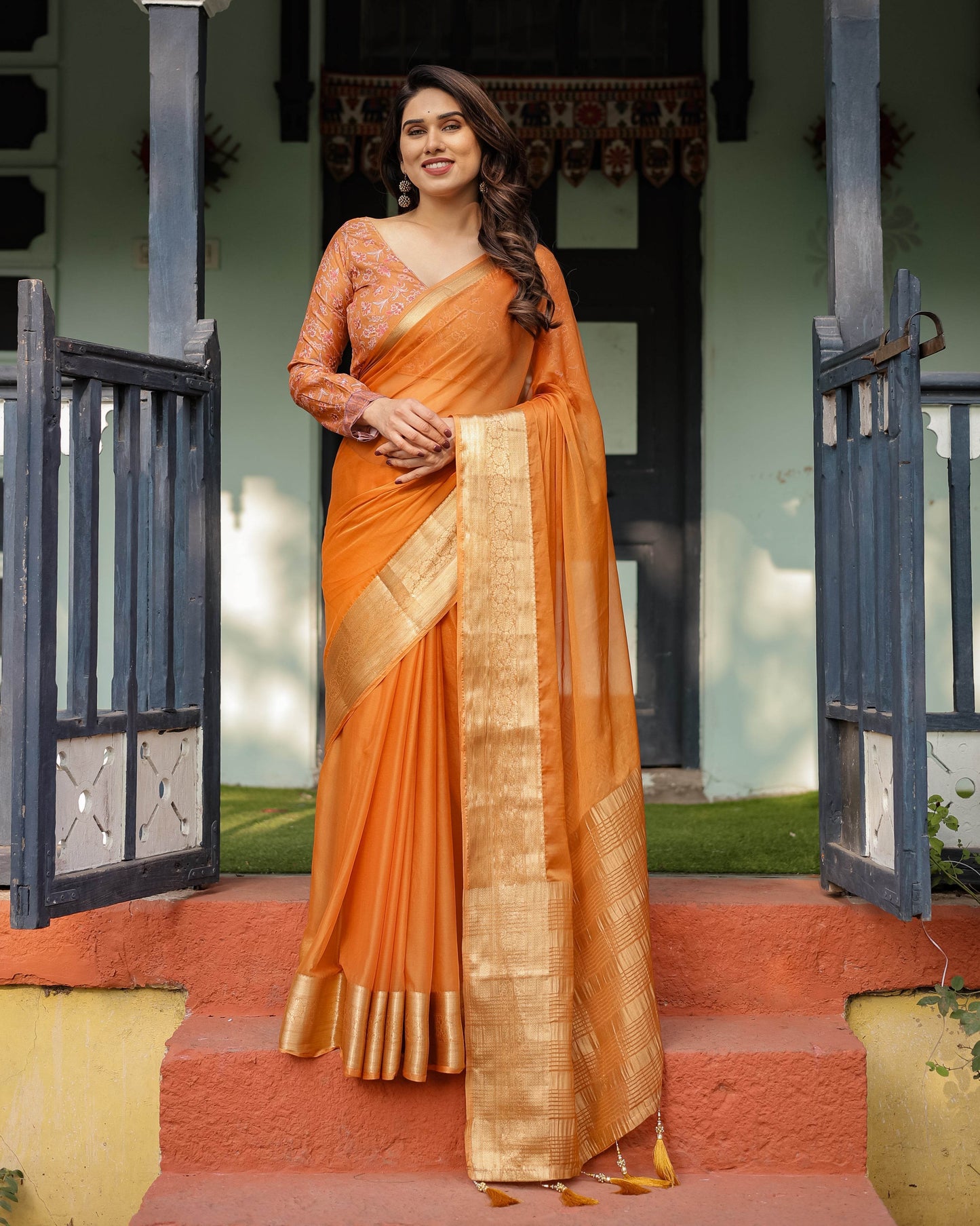 Sunset Orange Plain Chiffon Saree with Gold Zari Border, Floral Embroidered Blouse & Tassel Detailing - SEEANS