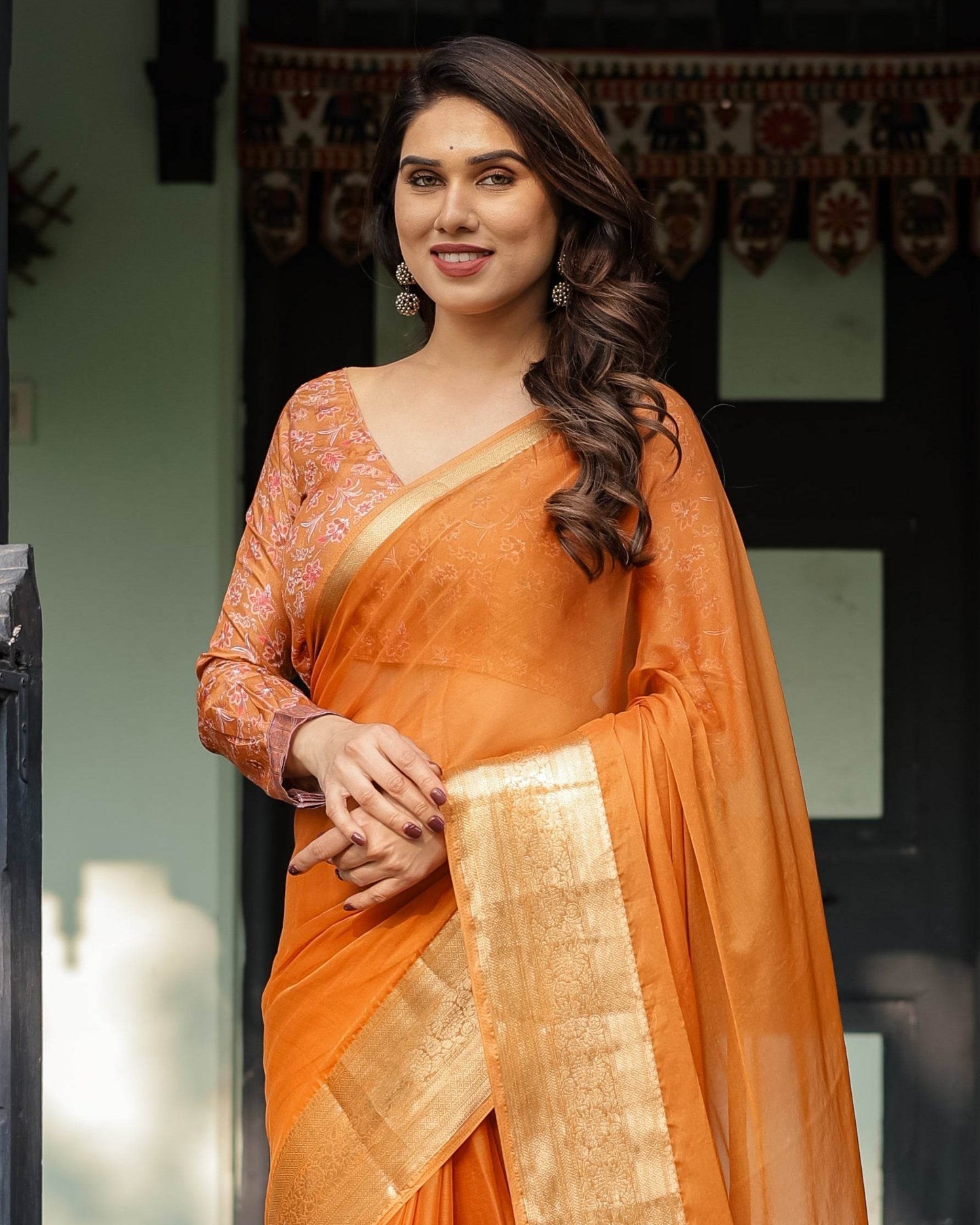 Sunset Orange Plain Chiffon Saree with Gold Zari Border, Floral Embroidered Blouse & Tassel Detailing - SEEANS