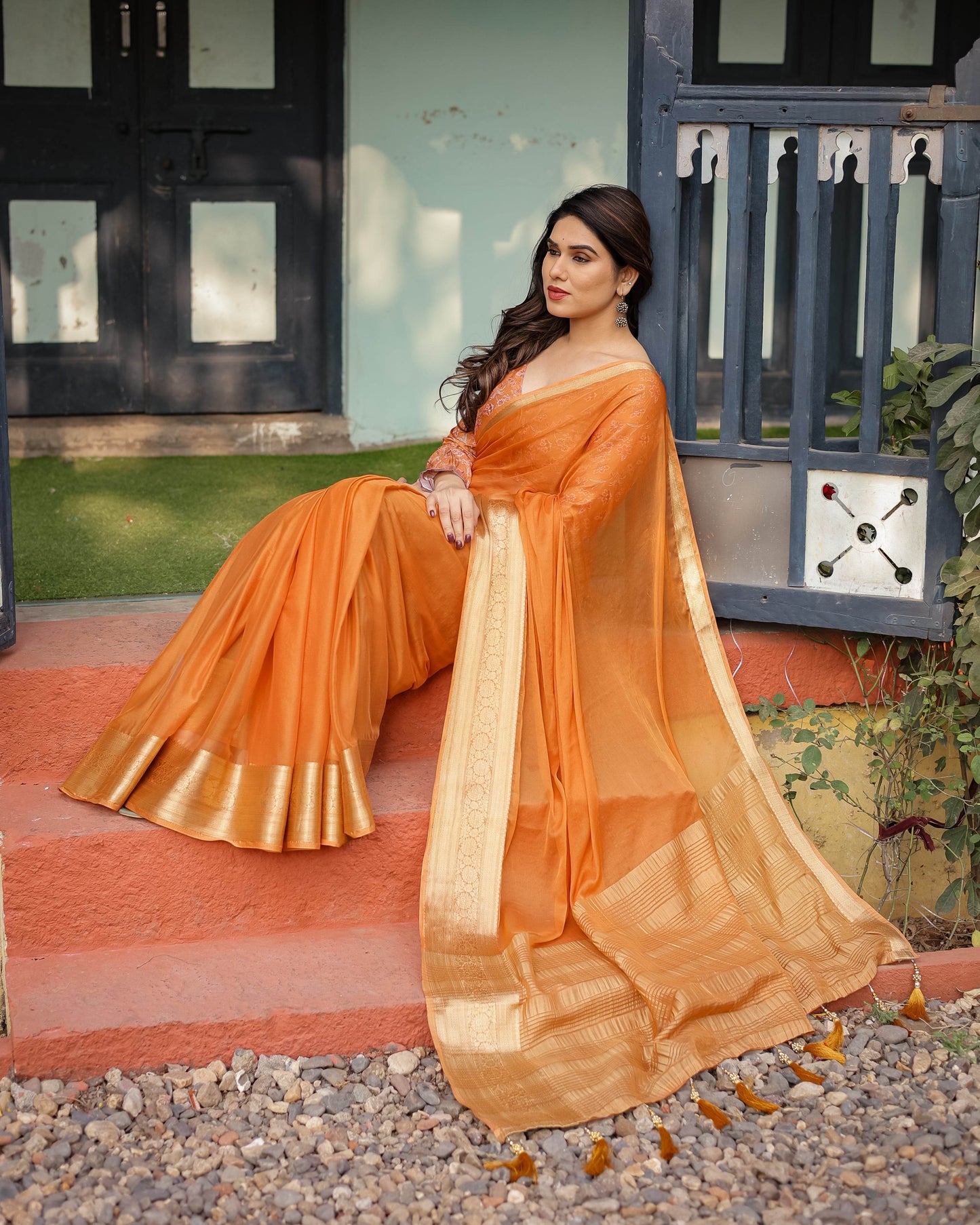 Sunset Orange Plain Chiffon Saree with Gold Zari Border, Floral Embroidered Blouse & Tassel Detailing - SEEANS