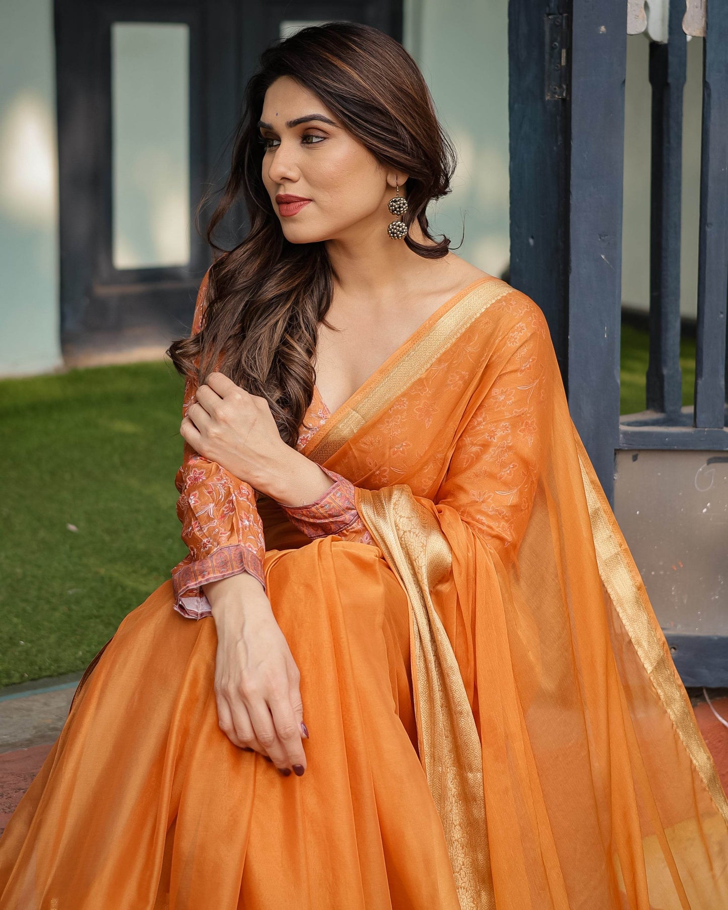 Sunset Orange Plain Chiffon Saree with Gold Zari Border, Floral Embroidered Blouse & Tassel Detailing - SEEANS