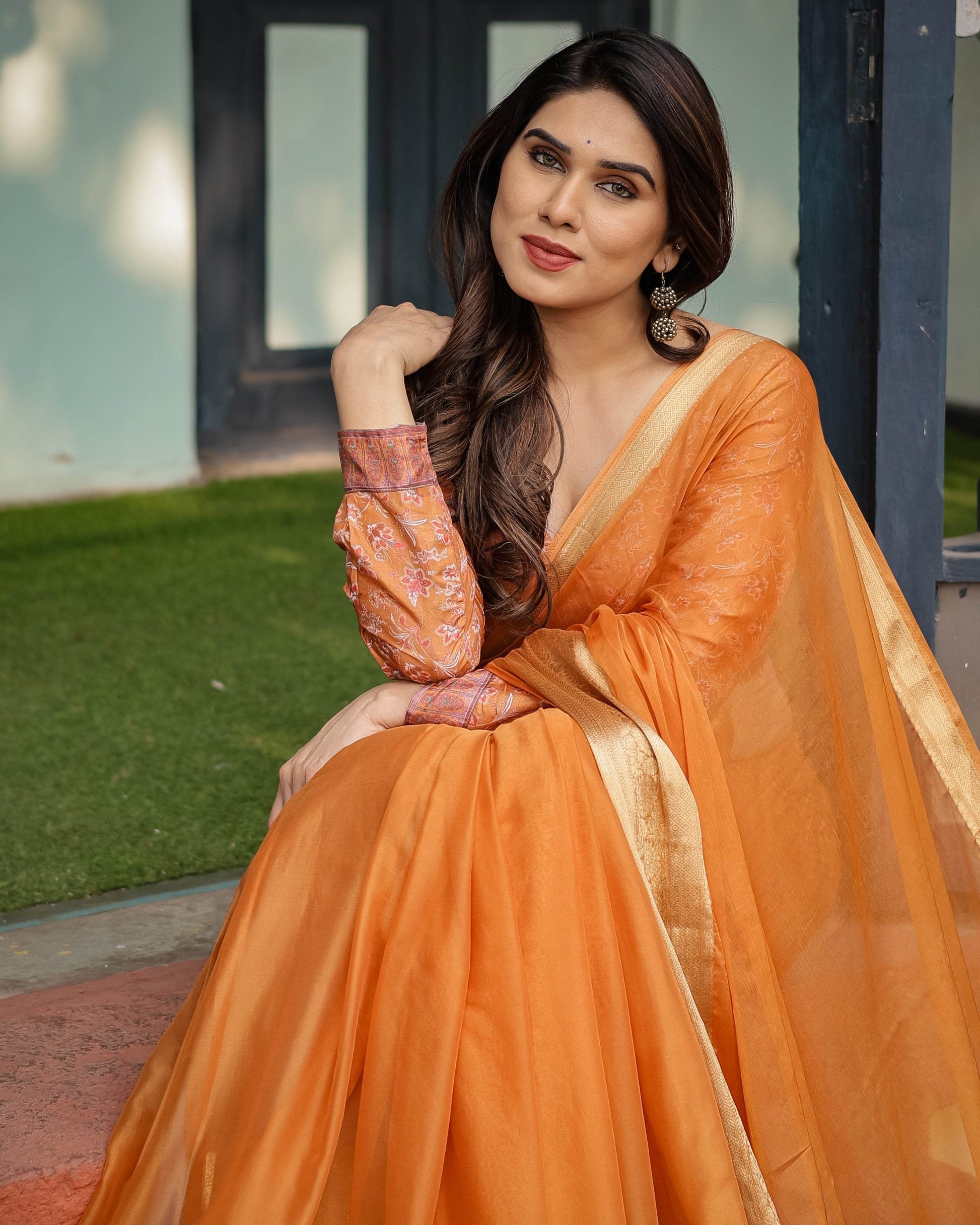 Sunset Orange Plain Chiffon Saree with Gold Zari Border, Floral Embroidered Blouse & Tassel Detailing - SEEANS