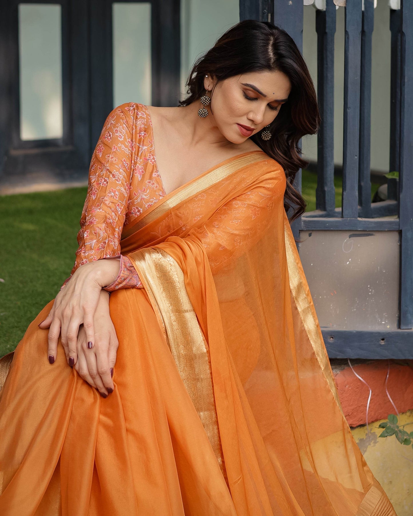 Sunset Orange Plain Chiffon Saree with Gold Zari Border, Floral Embroidered Blouse & Tassel Detailing - SEEANS