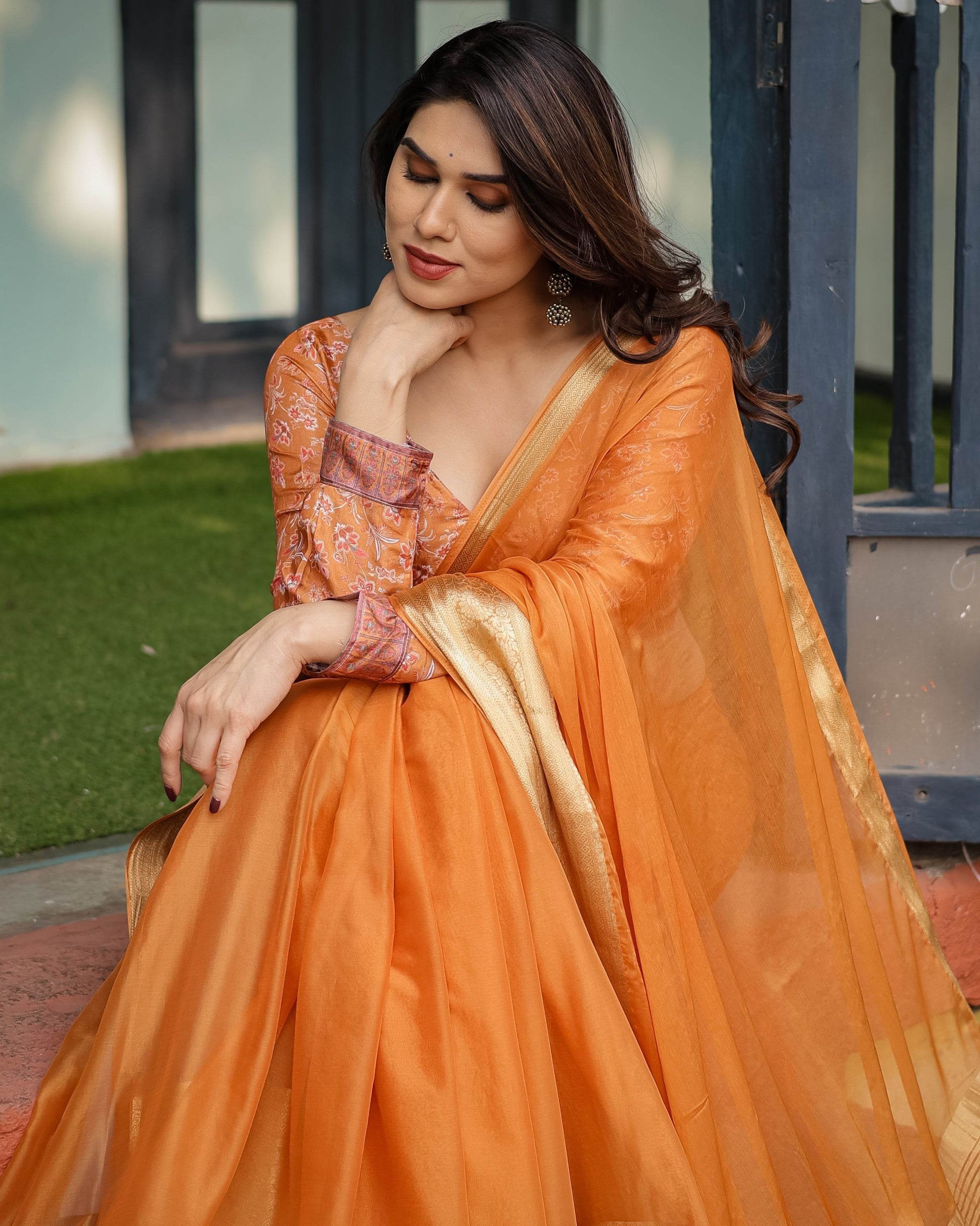 Sunset Orange Plain Chiffon Saree with Gold Zari Border, Floral Embroidered Blouse & Tassel Detailing - SEEANS