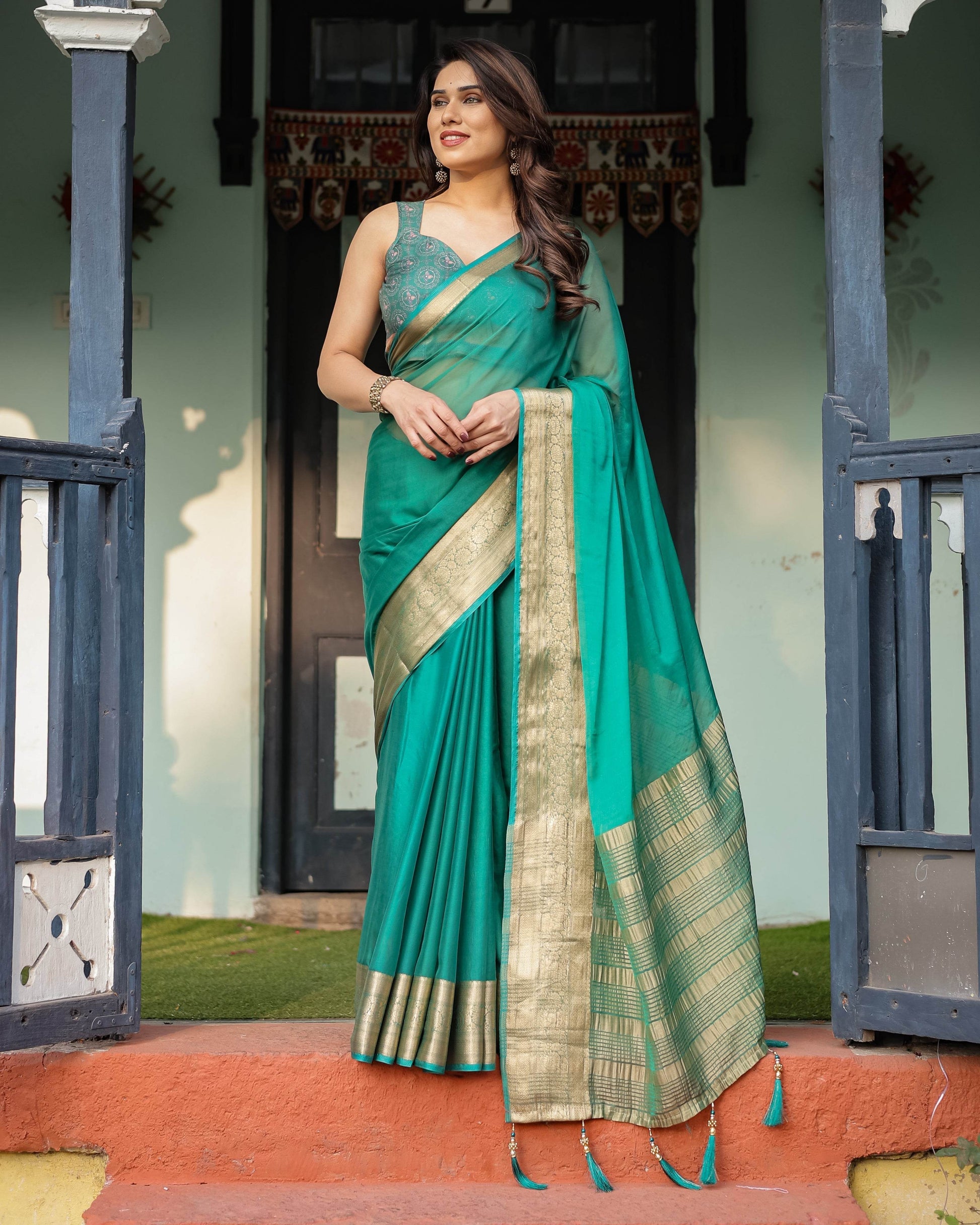 Elegant Sea Green Plain Chiffon Saree with Gold Zari Border, Paisley Printed Blouse & Tassel Detailing - SEEANS