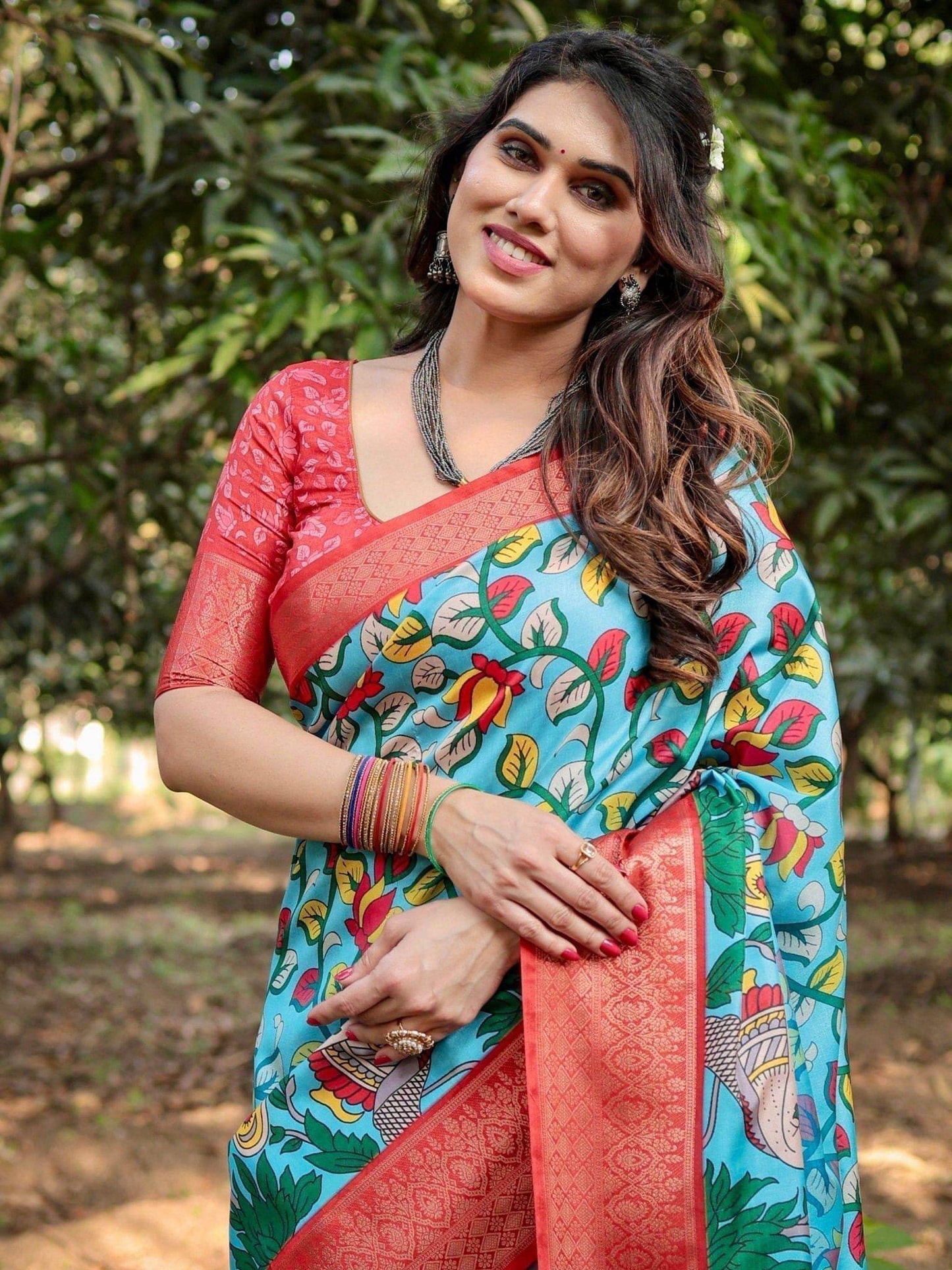 Aqua Blue Tussar Silk Saree with Vibrant Nature-Inspired Prints and Red Zari Border - SEEANS