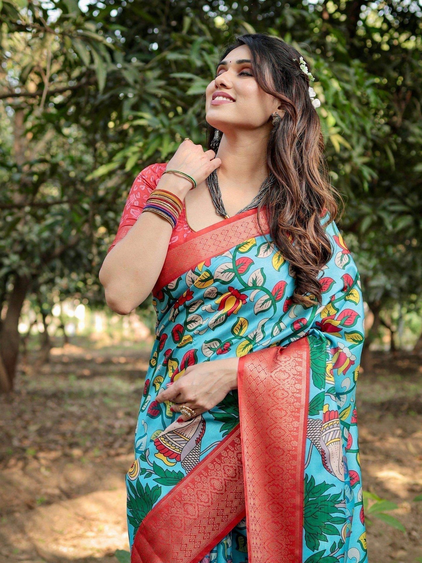 Aqua Blue Tussar Silk Saree with Vibrant Nature-Inspired Prints and Red Zari Border - SEEANS