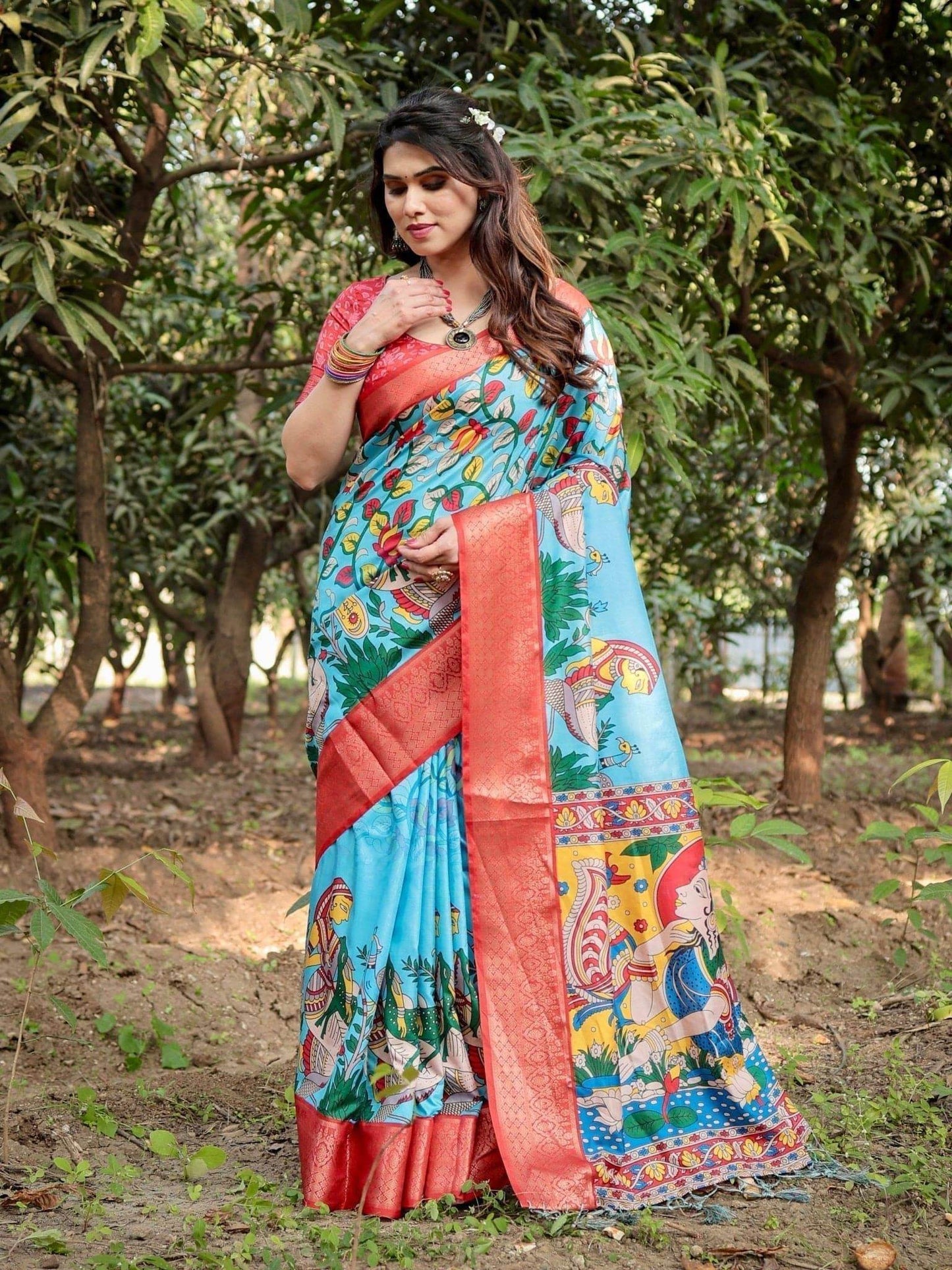 Aqua Blue Tussar Silk Saree with Vibrant Nature-Inspired Prints and Red Zari Border - SEEANS