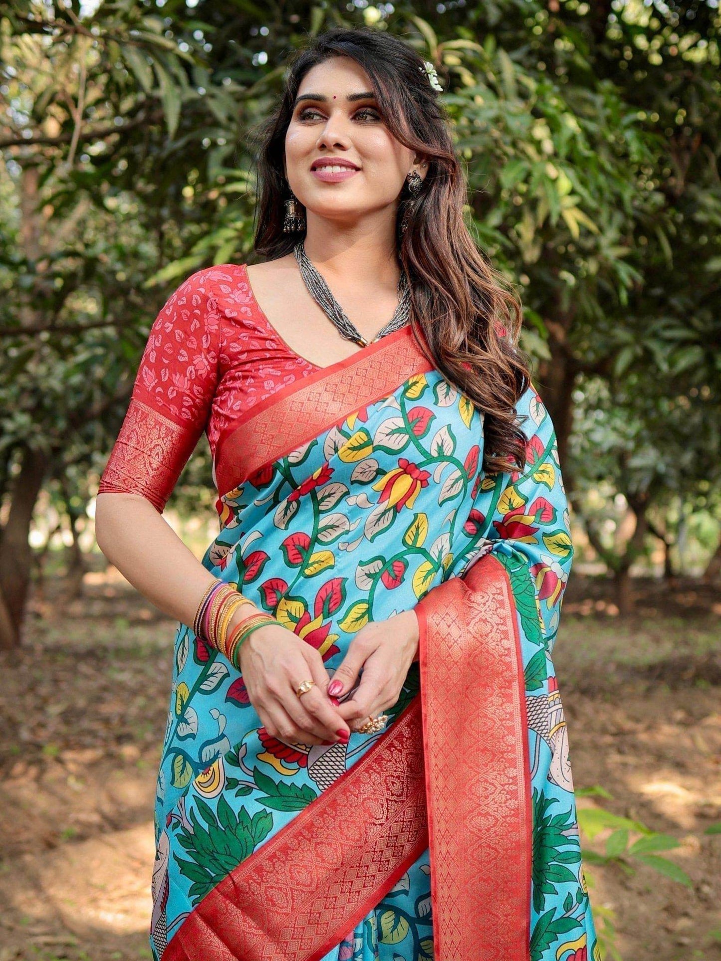 Aqua Blue Tussar Silk Saree with Vibrant Nature-Inspired Prints and Red Zari Border - SEEANS