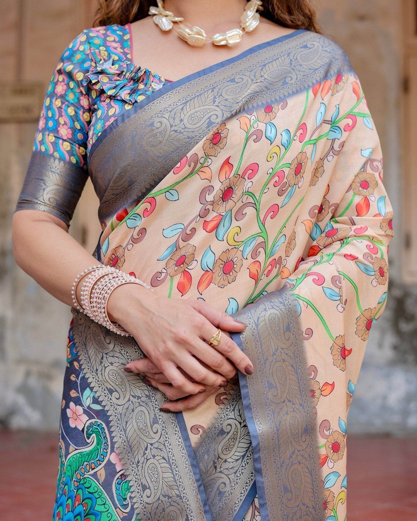 Peach and Navy Blue Floral Saree with Vibrant Peacock Pallu and Tassel Detailing - SEEANS