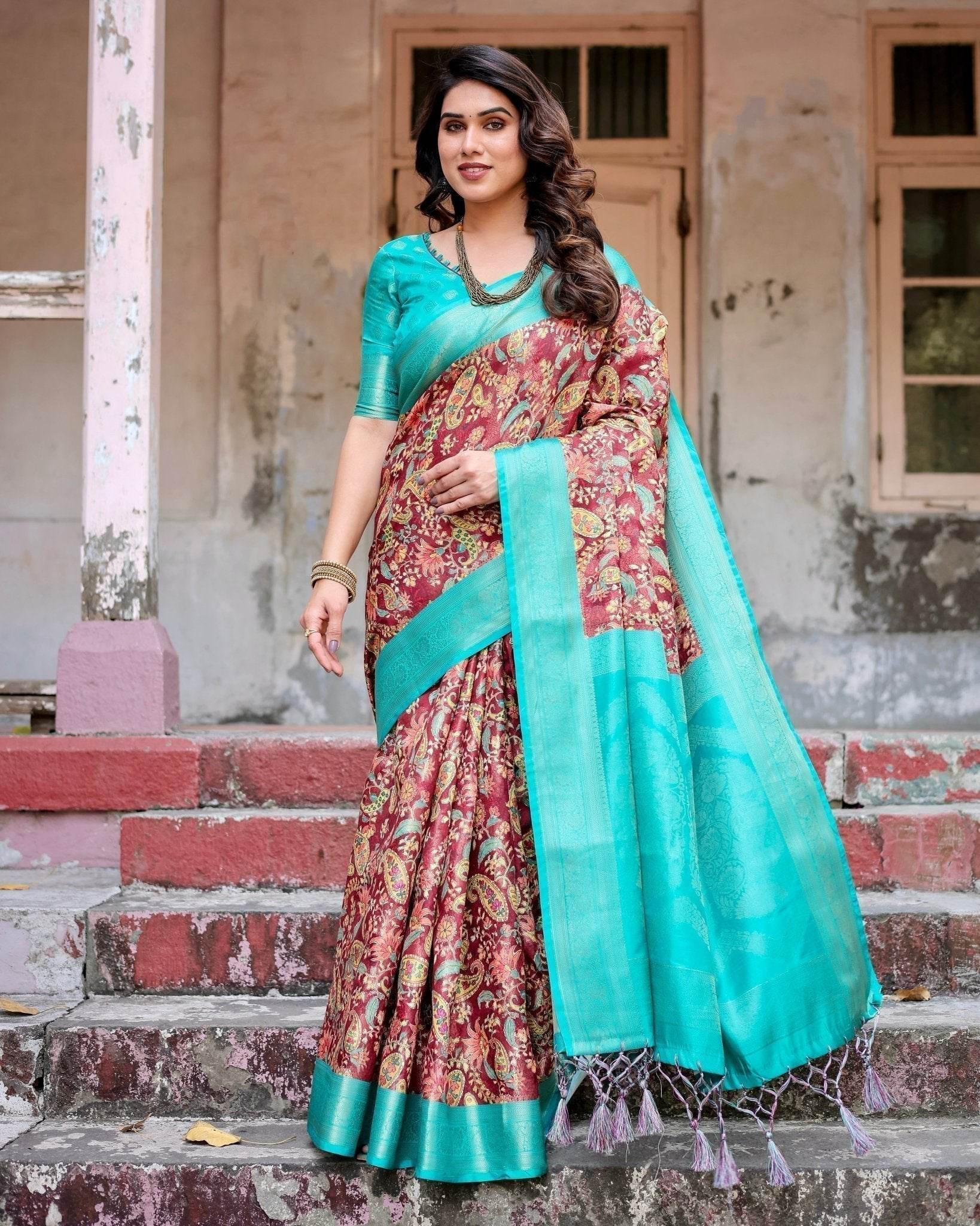 Maroon and Teal Paisley Design Banarasi Silk Saree with Zari Weave and Tassel-Embellished Pallu - SEEANS