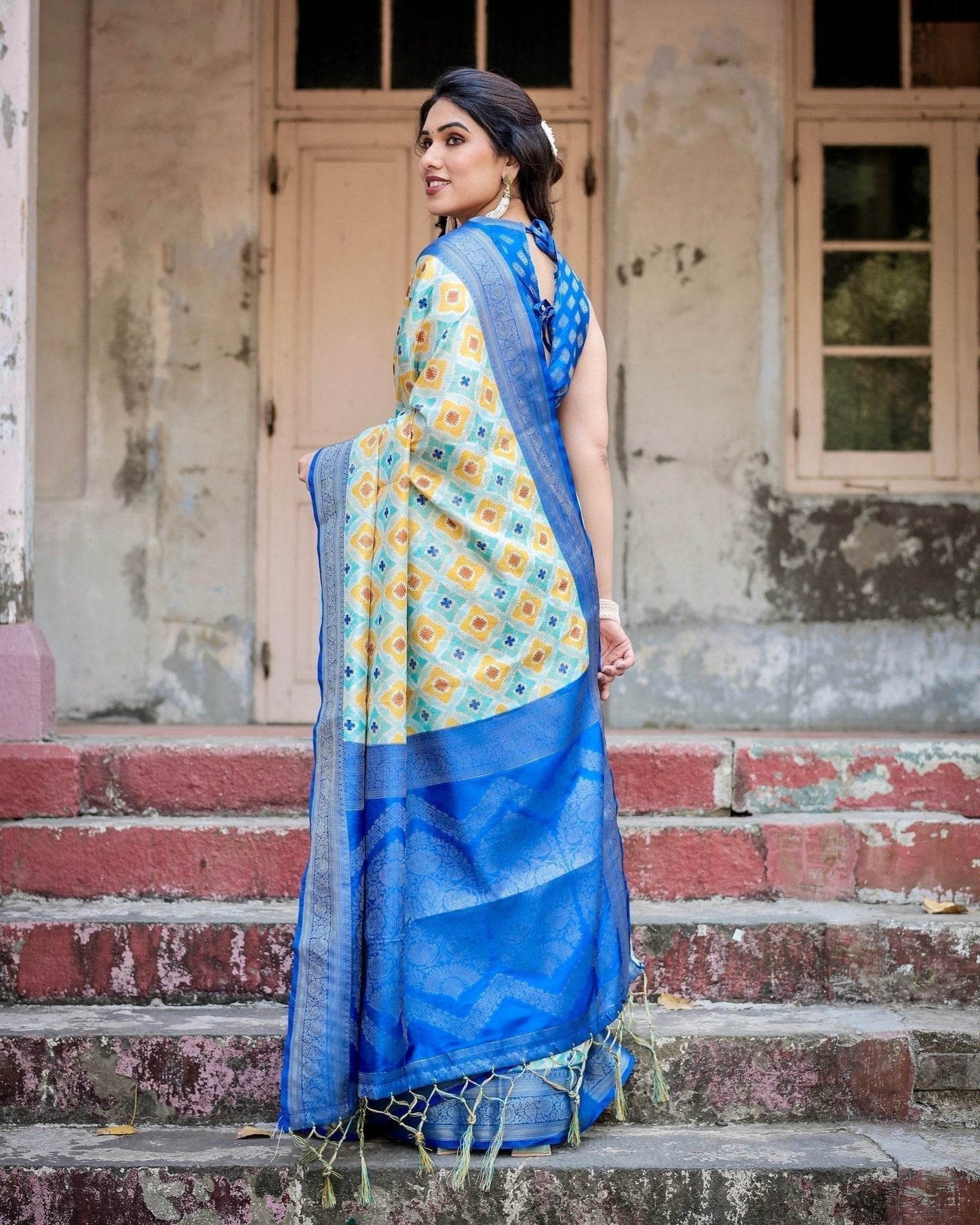 Yellow and Blue Ikat Digital Print Banarasi Silk Saree with Zari Weave and Tassel-Embellished Pallu - SEEANS