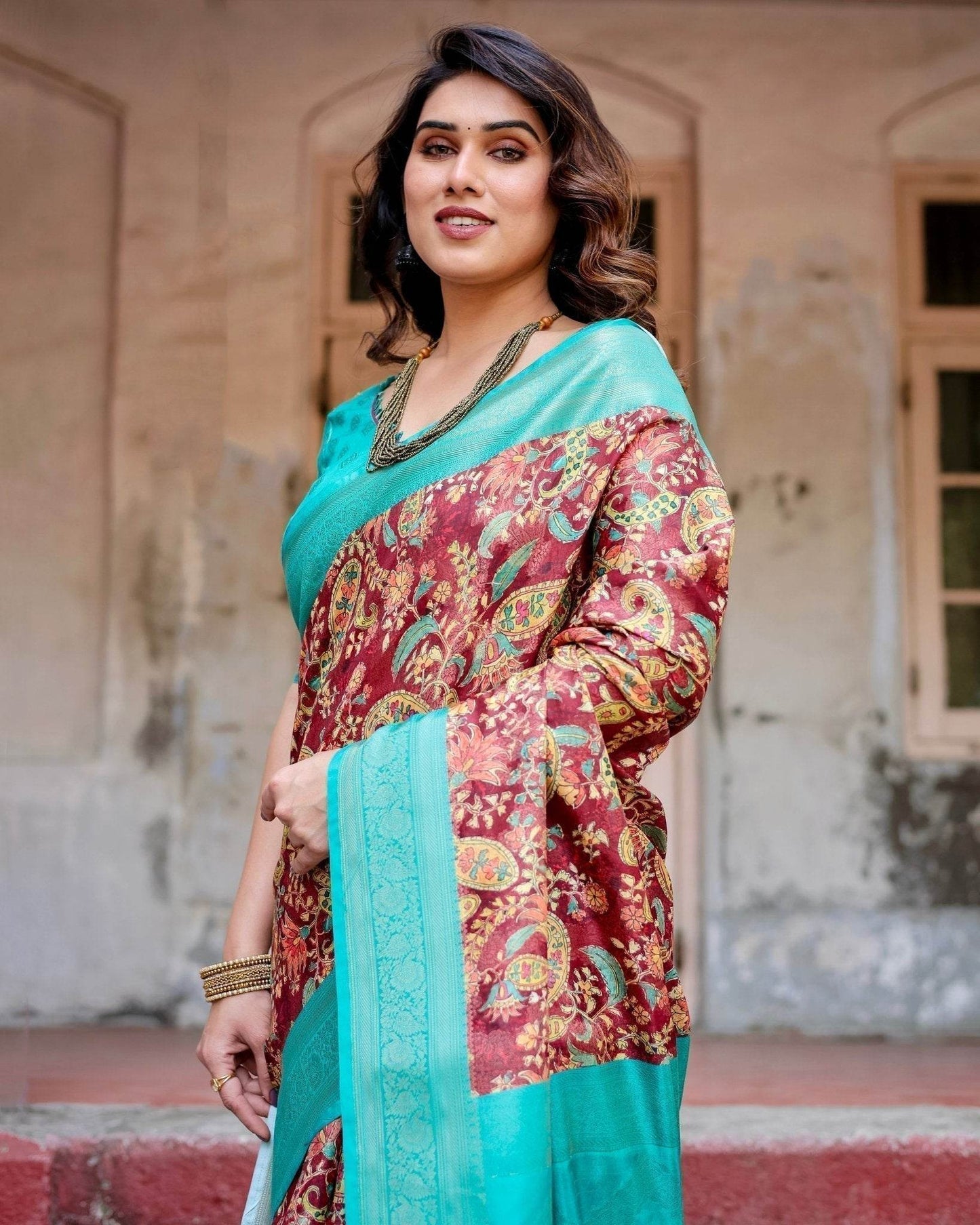 Maroon and Teal Paisley Design Banarasi Silk Saree with Zari Weave and Tassel-Embellished Pallu - SEEANS