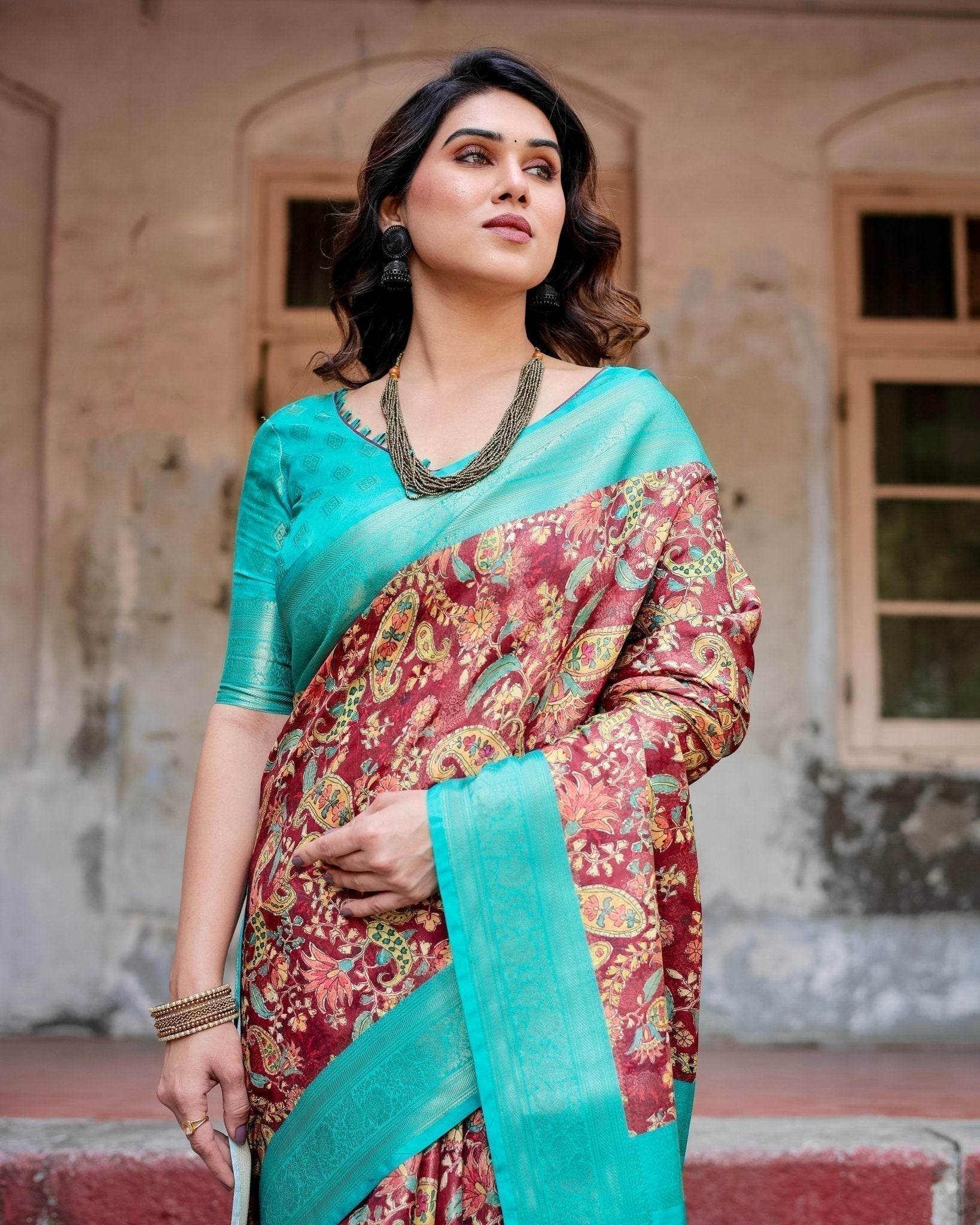 Maroon and Teal Paisley Design Banarasi Silk Saree with Zari Weave and Tassel-Embellished Pallu - SEEANS