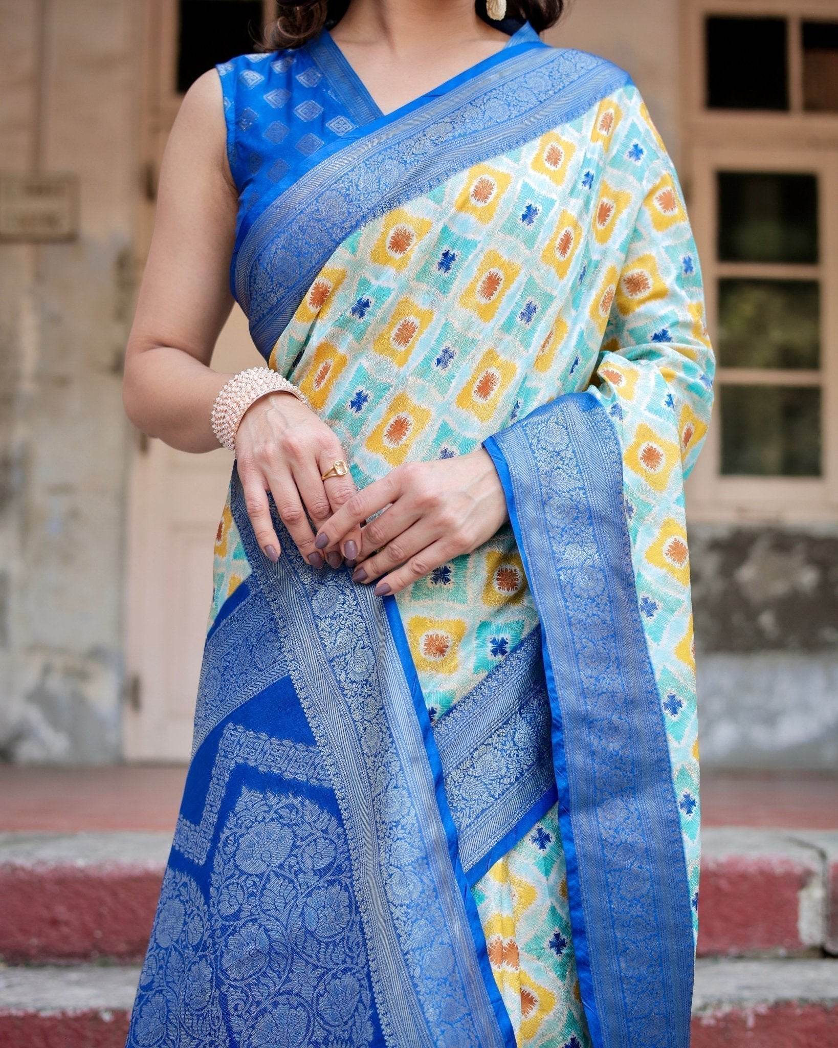 Yellow and Blue Ikat Digital Print Banarasi Silk Saree with Zari Weave and Tassel-Embellished Pallu - SEEANS