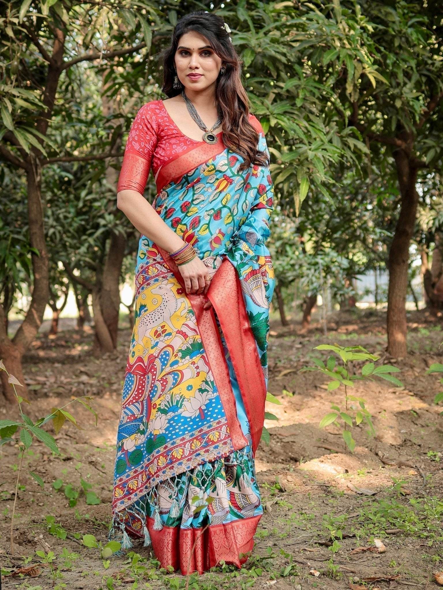 Aqua Blue Tussar Silk Saree with Vibrant Nature-Inspired Prints and Red Zari Border - SEEANS