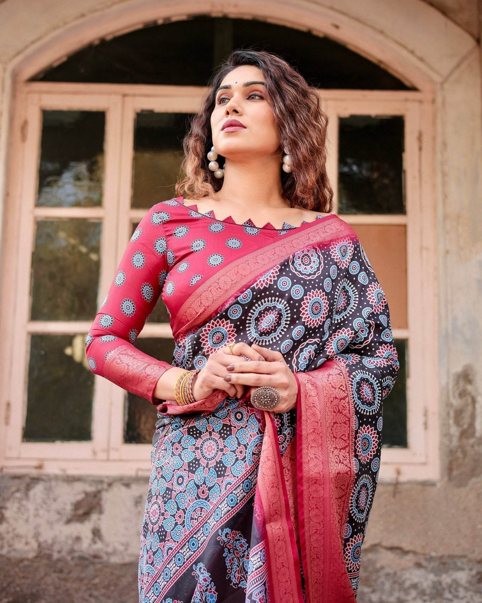 Black and Coral Tussar Silk Saree with Intricate Circular Motifs and Ornamental Pallu - SEEANS