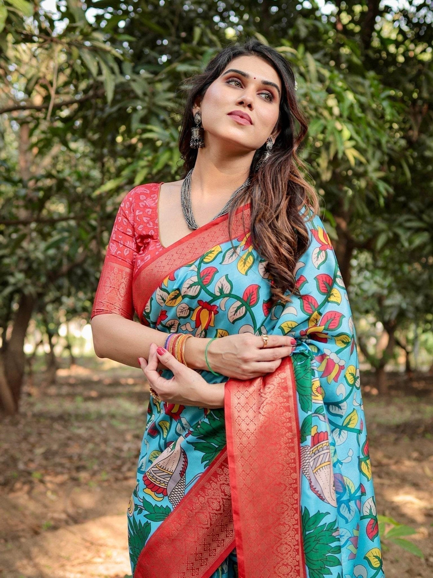 Aqua Blue Tussar Silk Saree with Vibrant Nature-Inspired Prints and Red Zari Border - SEEANS